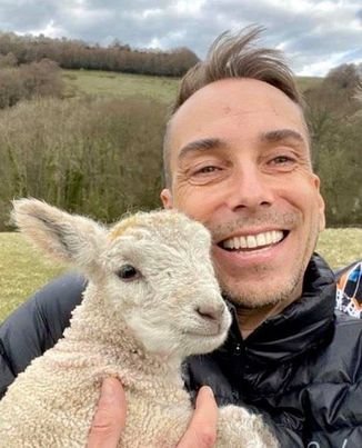 Todd Sinclair holding a lamb