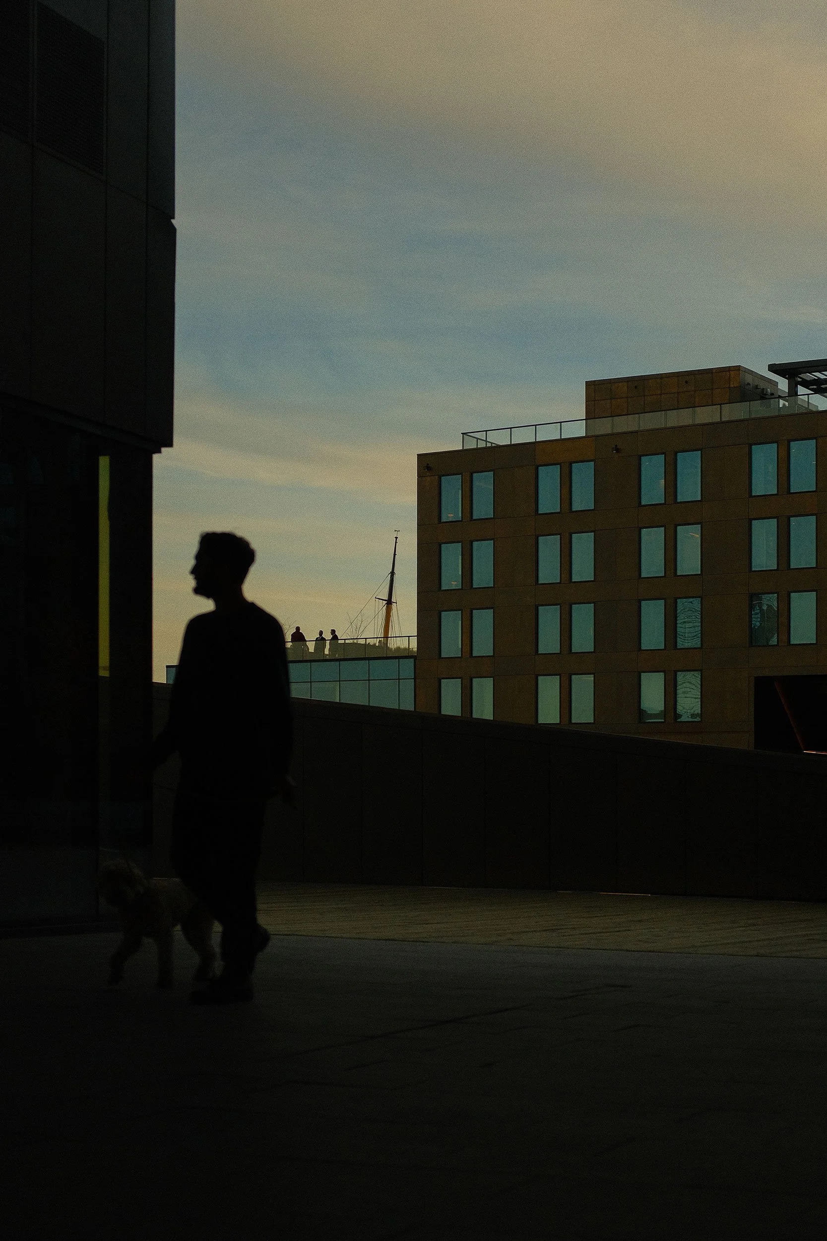 Man in silhouette at Queen's Marque, Halifax.