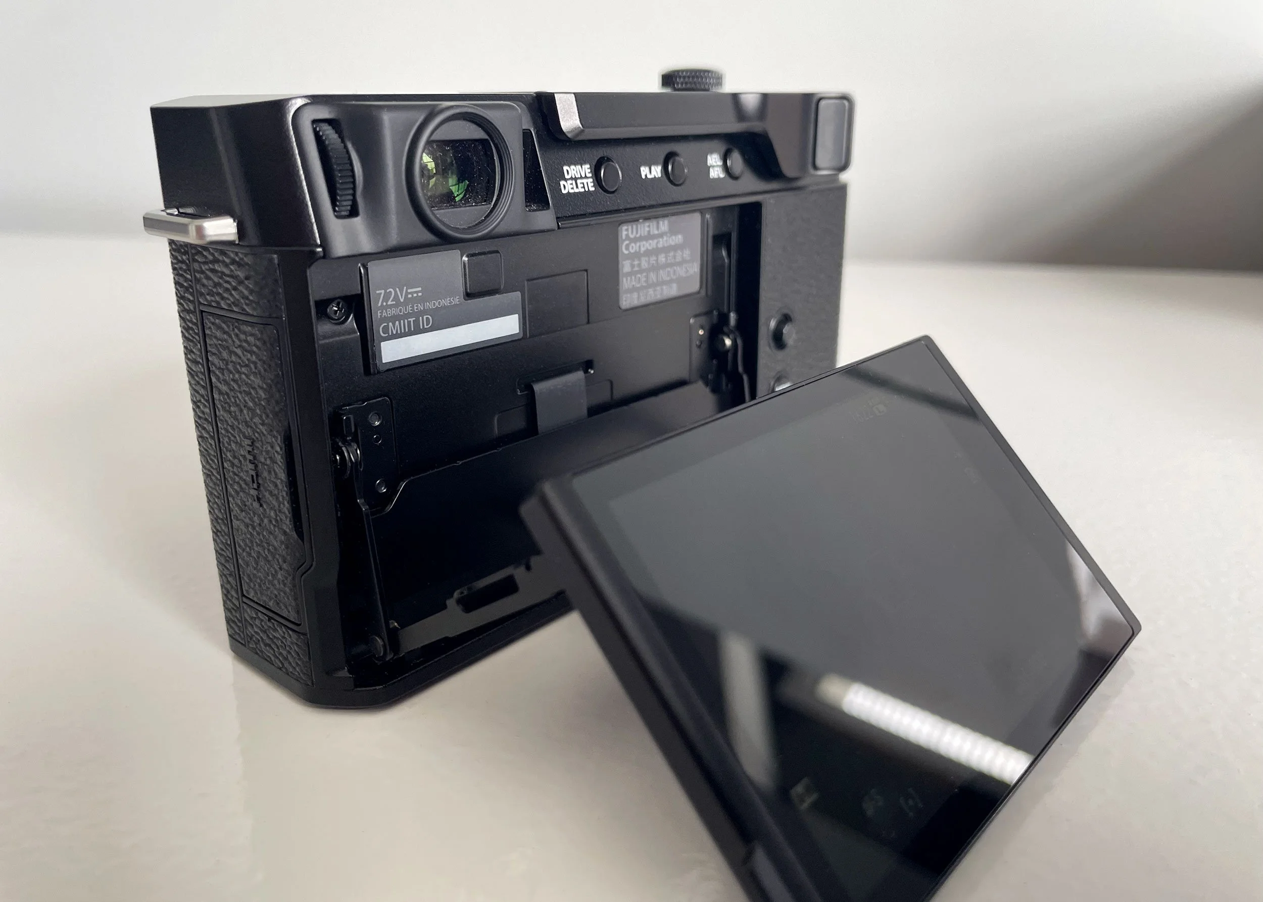 Fujifilm X-E4 rear view with tilted screen.