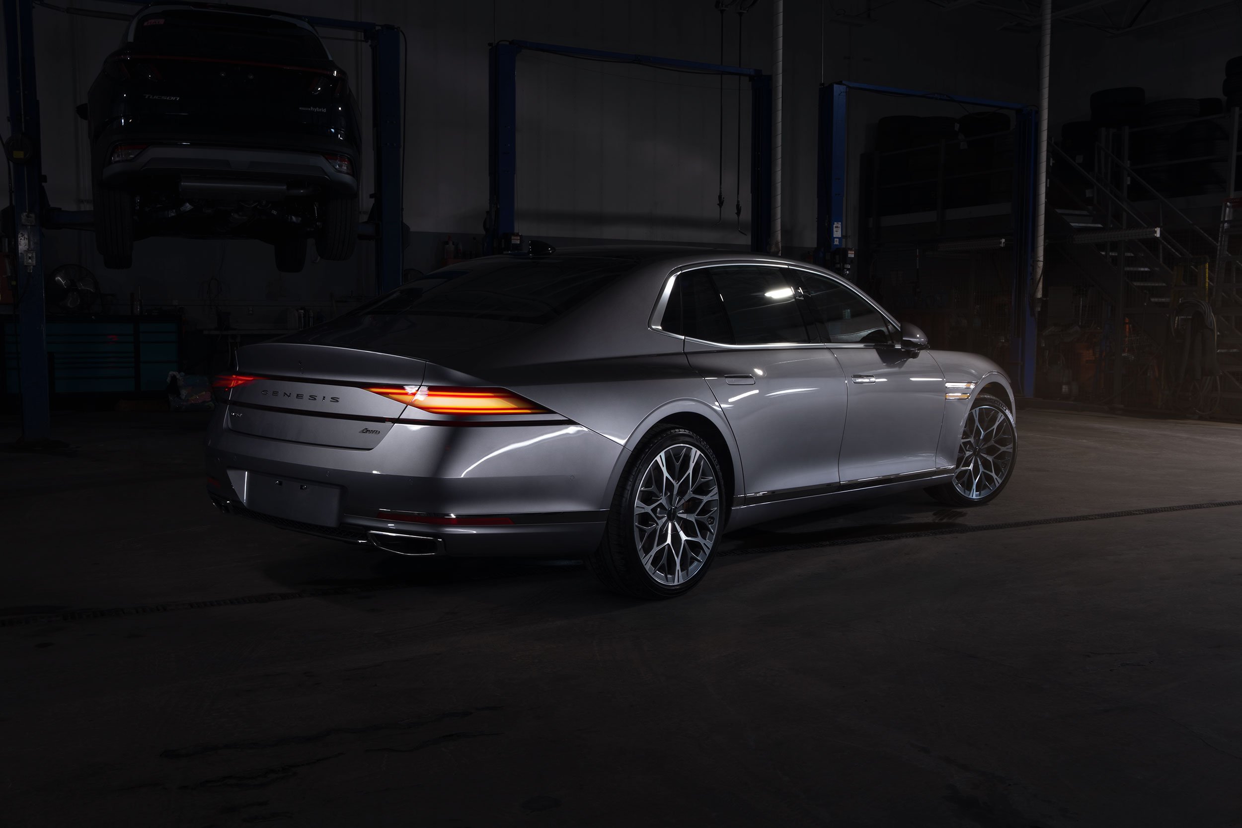 2026 Genesis G90 in a service bay, light painted.