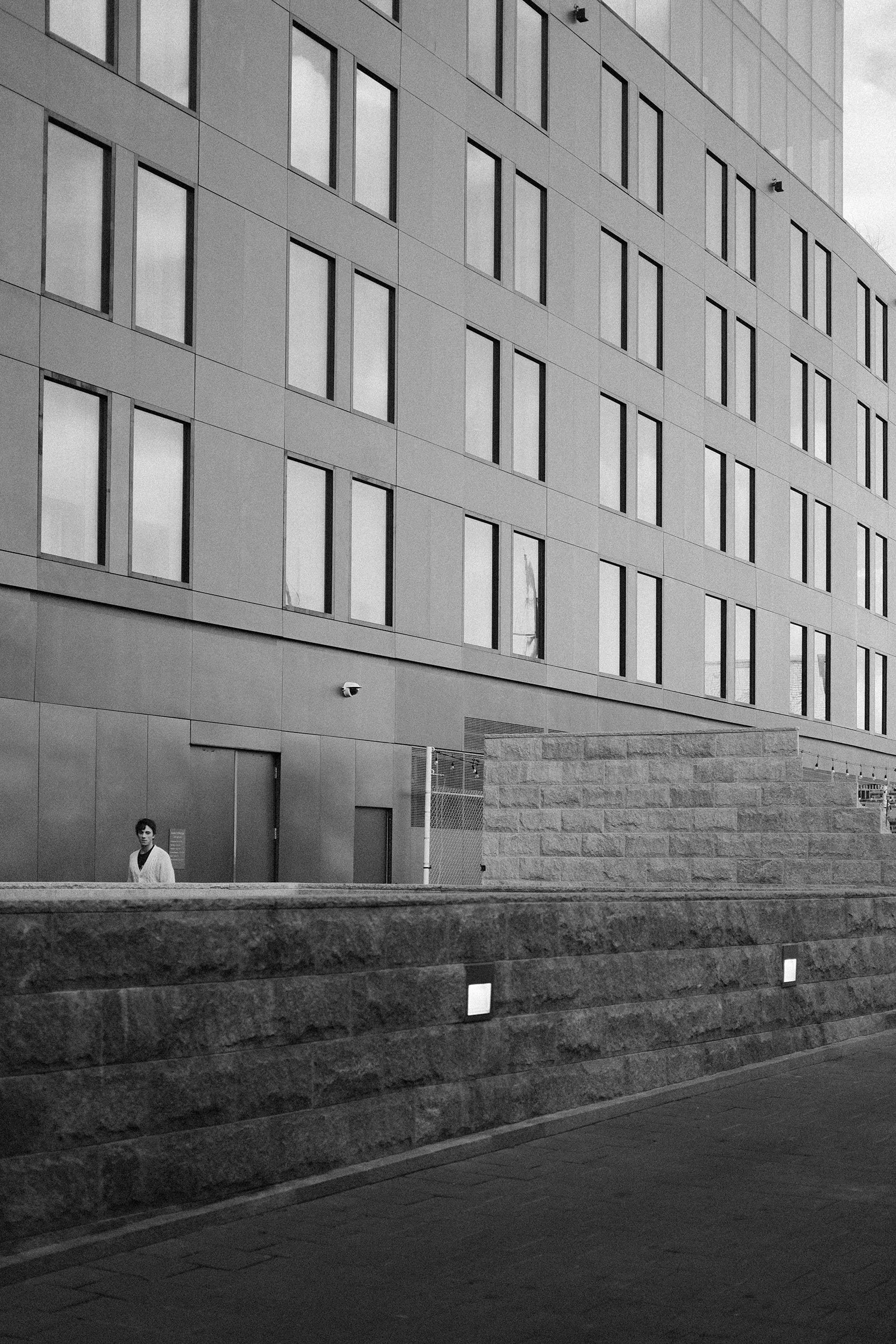Man near building facade.