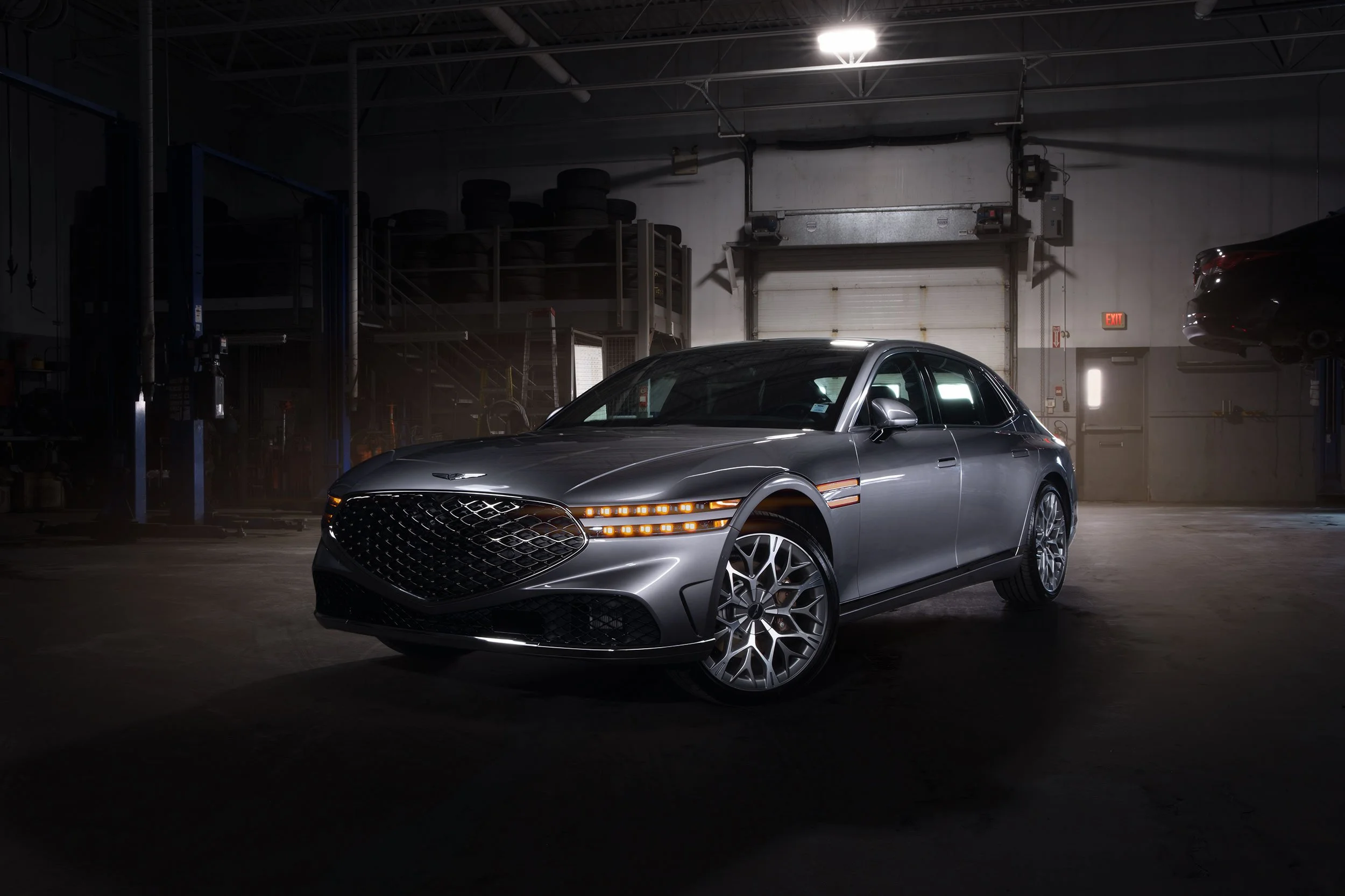 2026 Genesis G90 in a service bay, light painted.