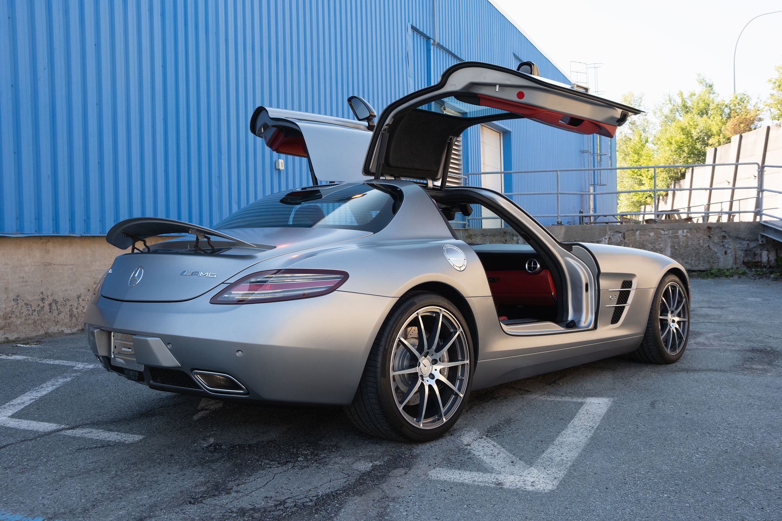 2011 Mercedes-Benz SLS AMG outdoors with doors open.