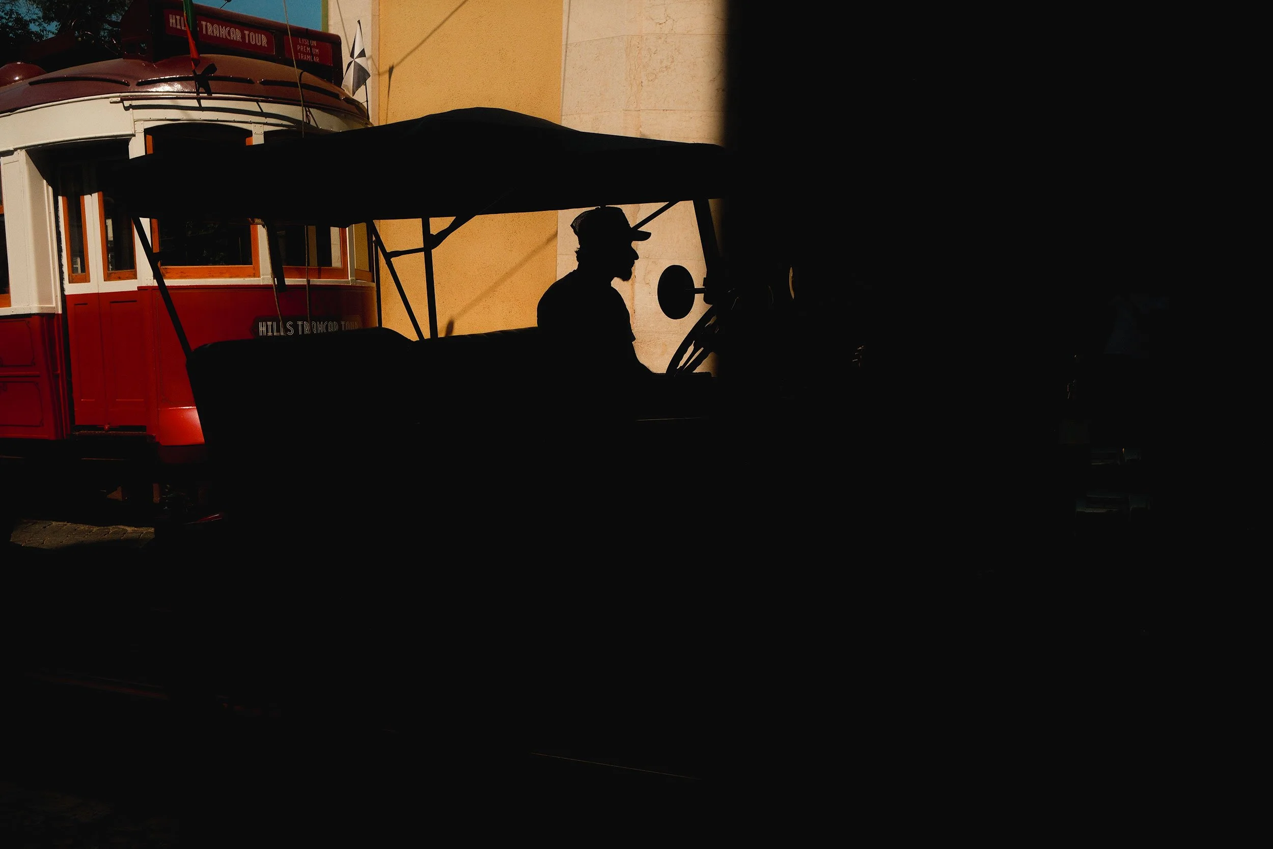 Lisbon tram with person silhouette.