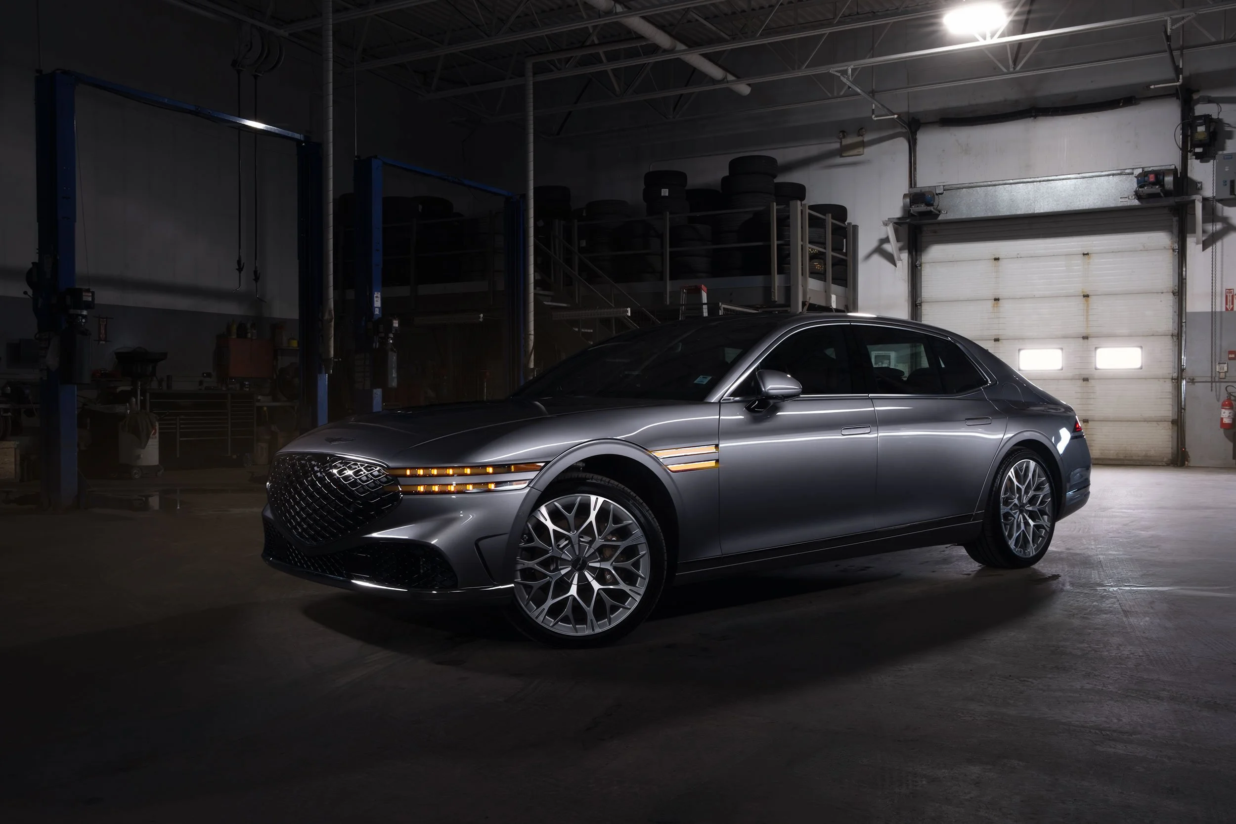 2026 Genesis G90 in a service bay, light painted.