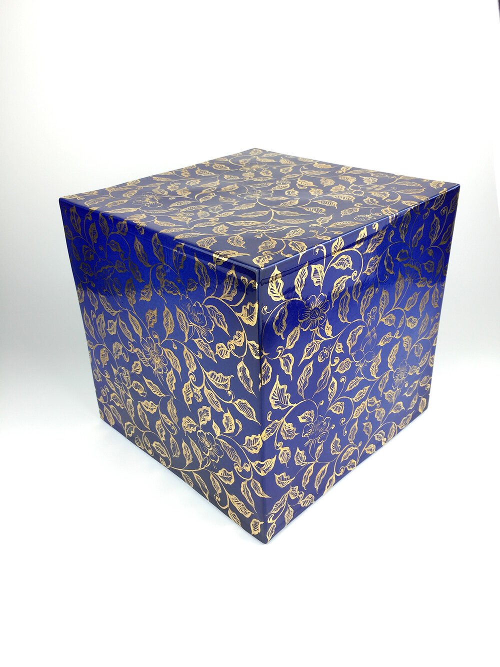A-cube-with-gilded-intertwined-branches-and-flowers-on-a-blue-ground.jpg