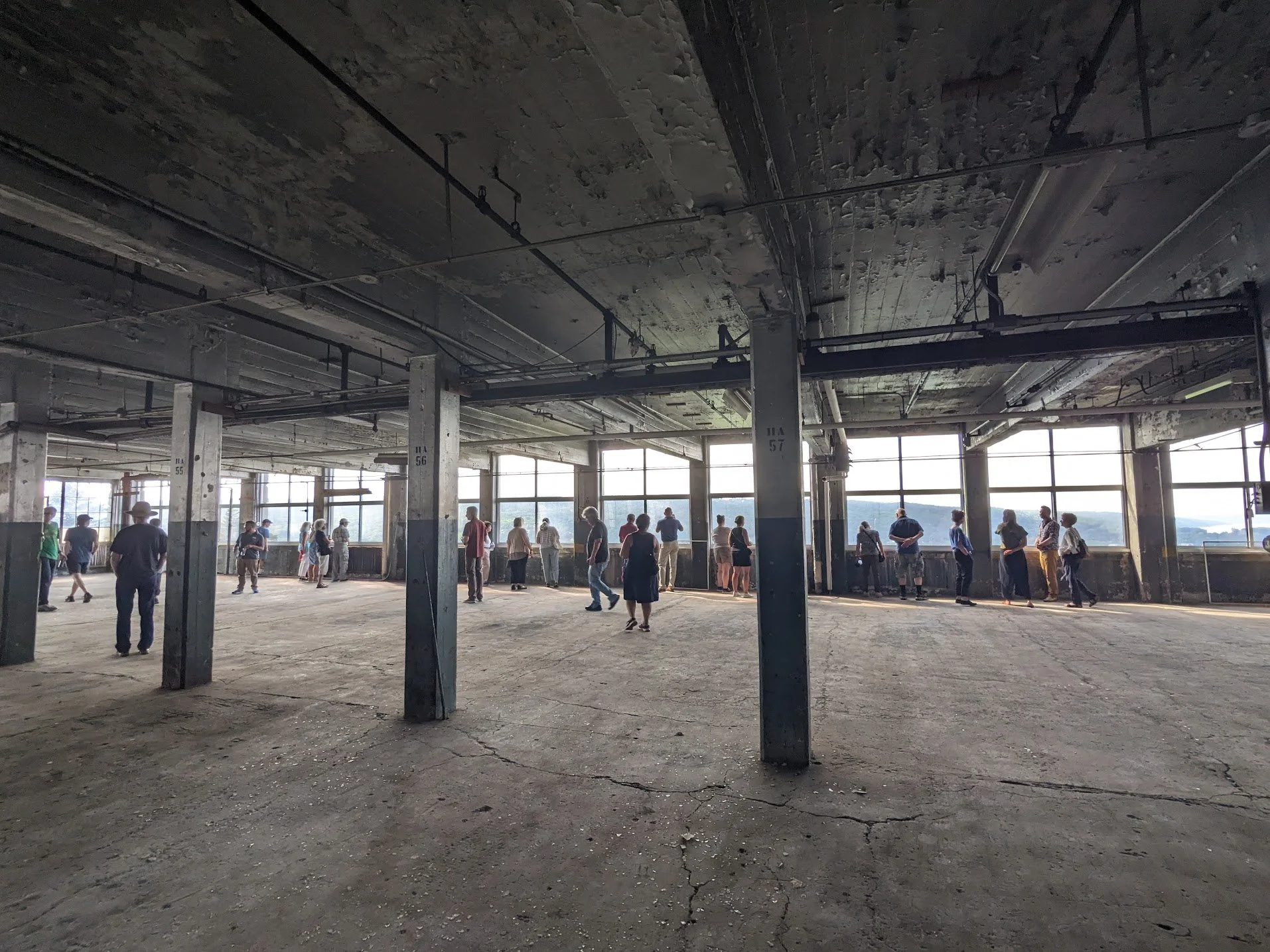 Tour group admiring view from SouthWorks building, overlooking Cayuga Lake