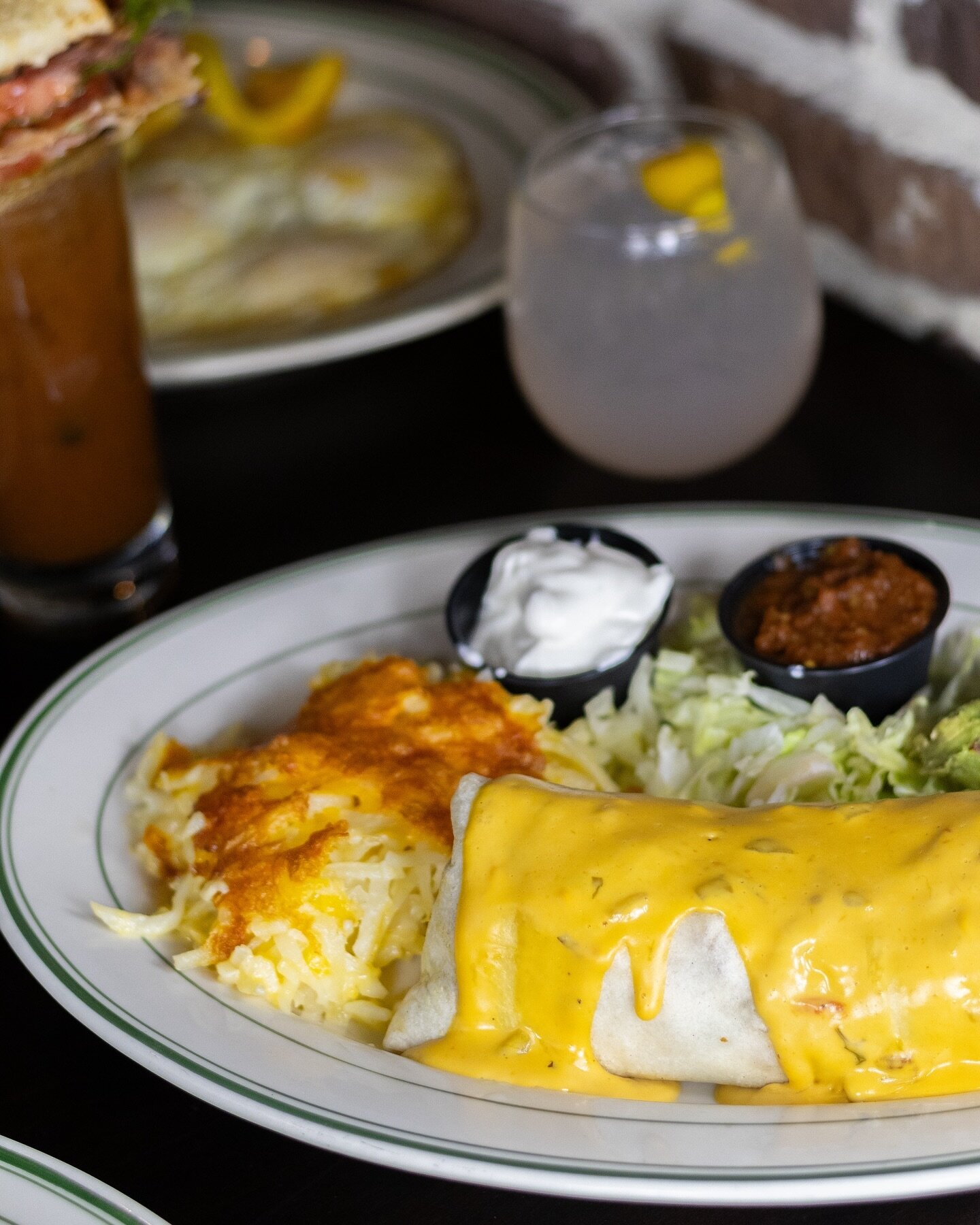 Wake up on the right side of the bed with our breakfast burrito, filled with bacon, chorizo, eggs, peppers, onions &amp; smothered in cheese sauce. Breakfast starts at 9 AM! 🌯🌞