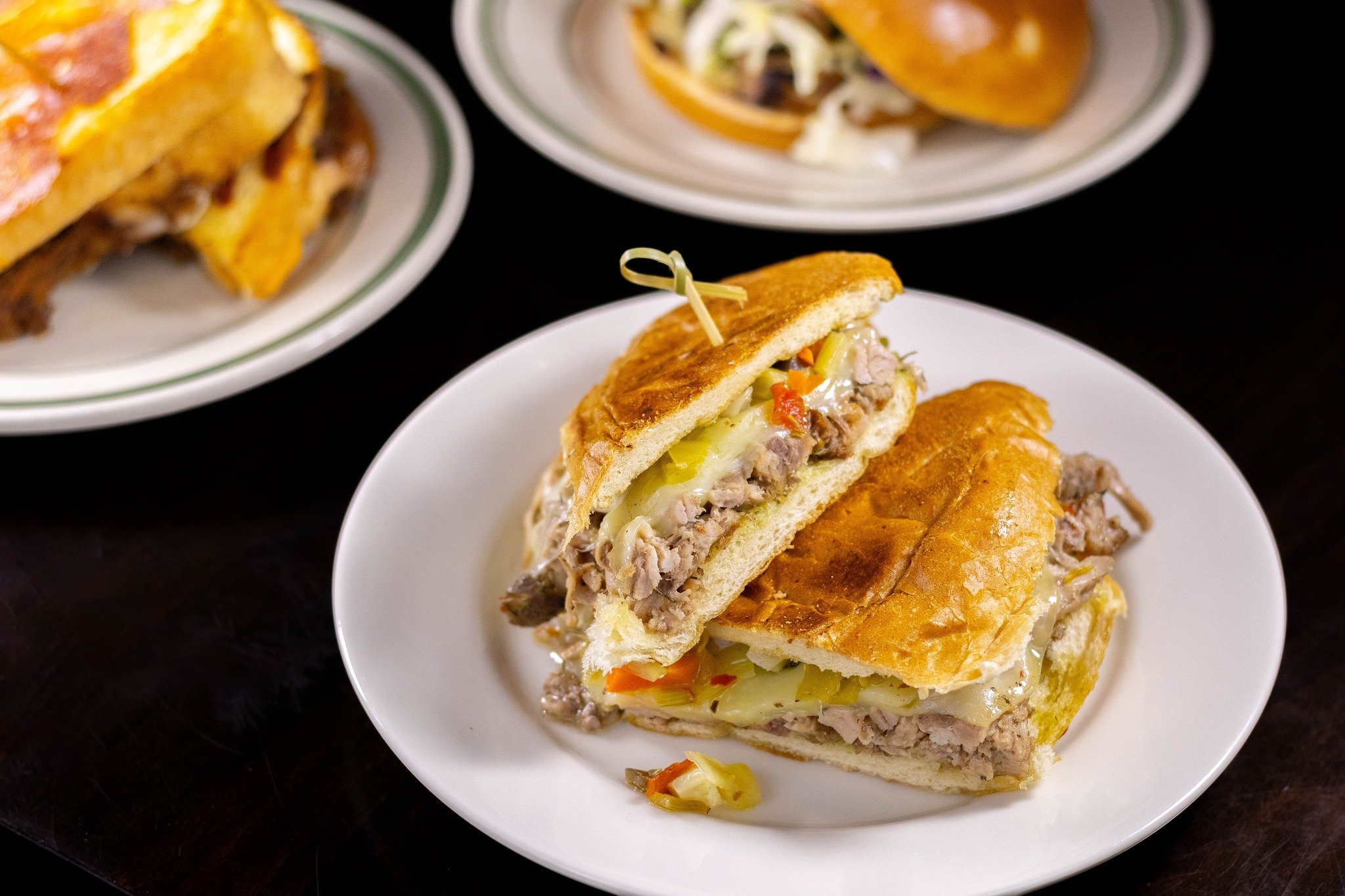 Our new porketta sandwich is filled with slow-roasted pork, pesto mayo, provolone cheese &amp; giardiniera on a hoagie bun that is pressed panini-style. Served with your choice of a side! 🥪