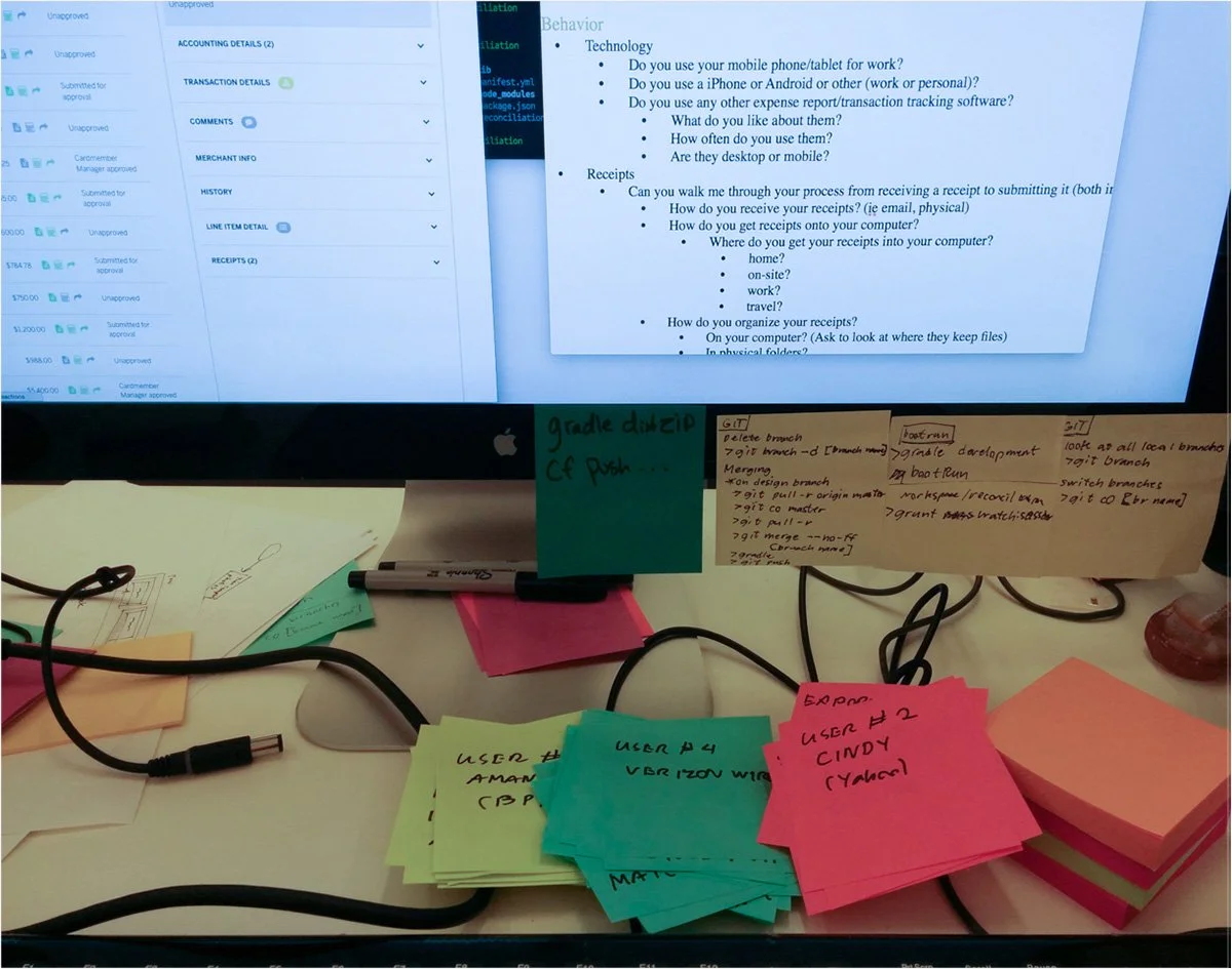 Desk with user interview script, post-it notes and testing prototype