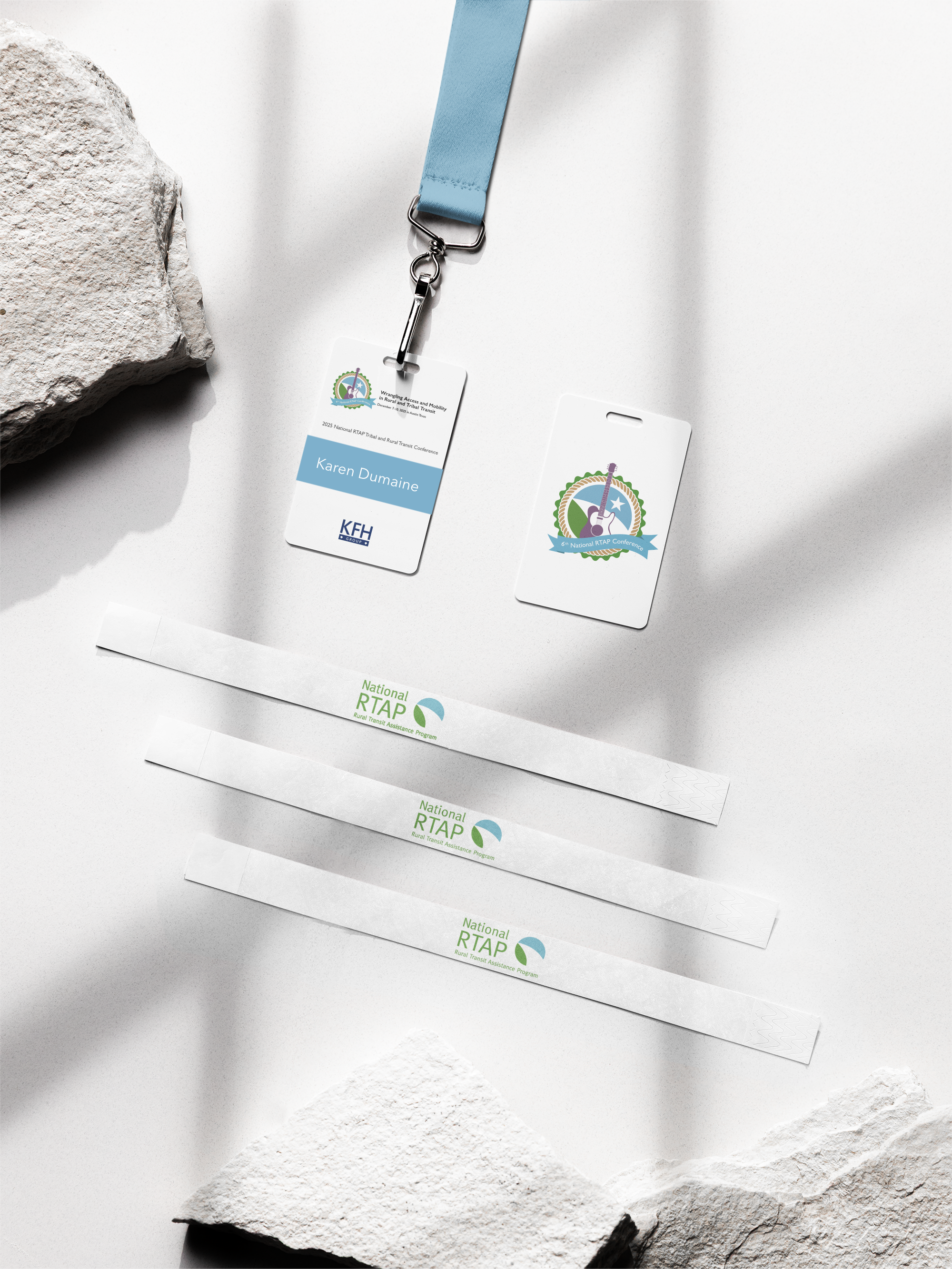 wristband-mockup-featuring-two-badge-holders-and-a-lanyard-lying-on-a-surface-with-a-rock-m58150.png