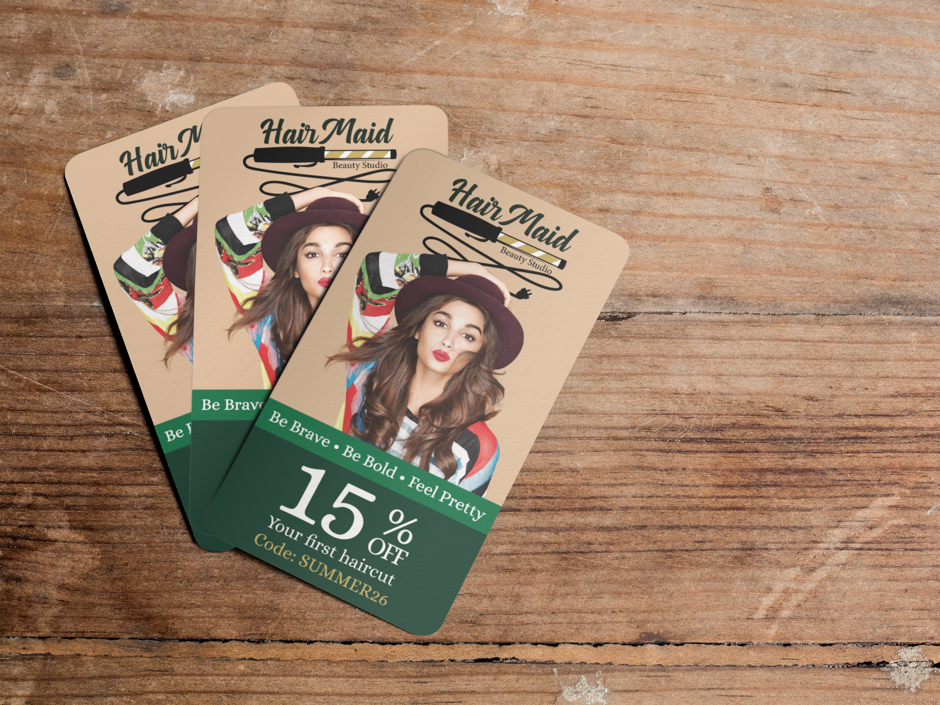 mockup-featuring-three-business-cards-lying-on-top-of-a-wooden-table-a6289.png