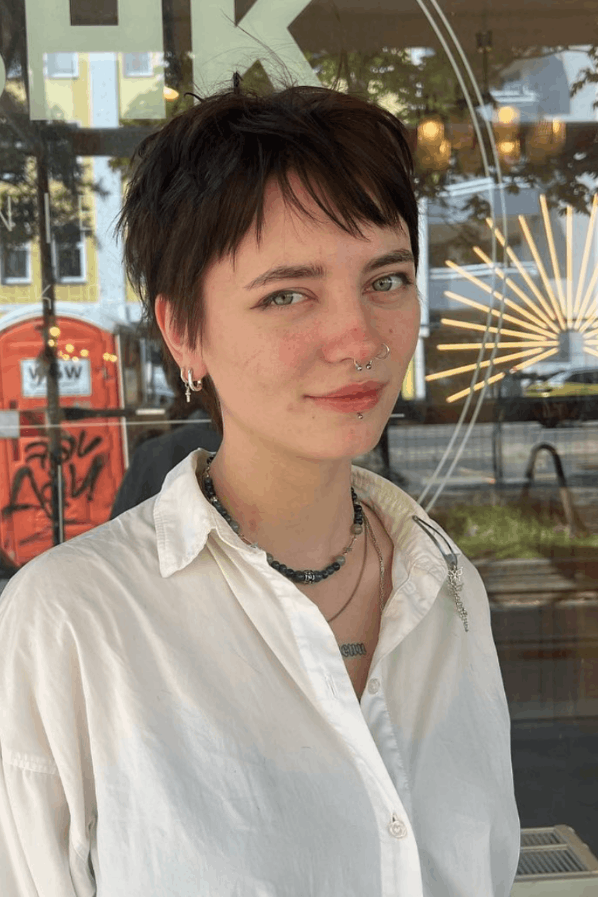 Front-facing image of a person wearing Wispy-Edged Pixie for Fine Hair, featuring light, wispy ends, soft layering, and a delicate fringe designed to add movement without bulk.