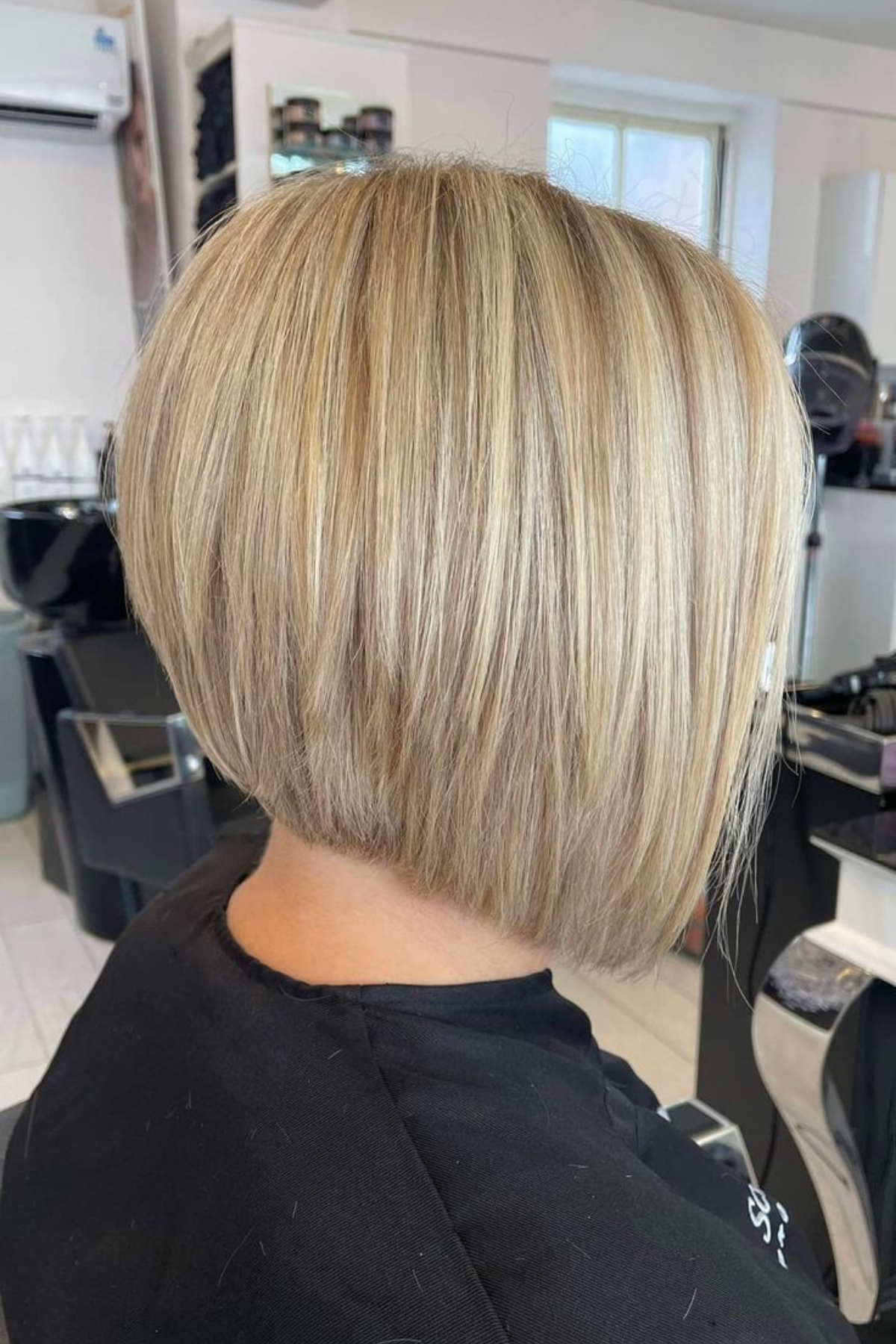 A stacked bob seen from behind showing graduation and lift at the nape