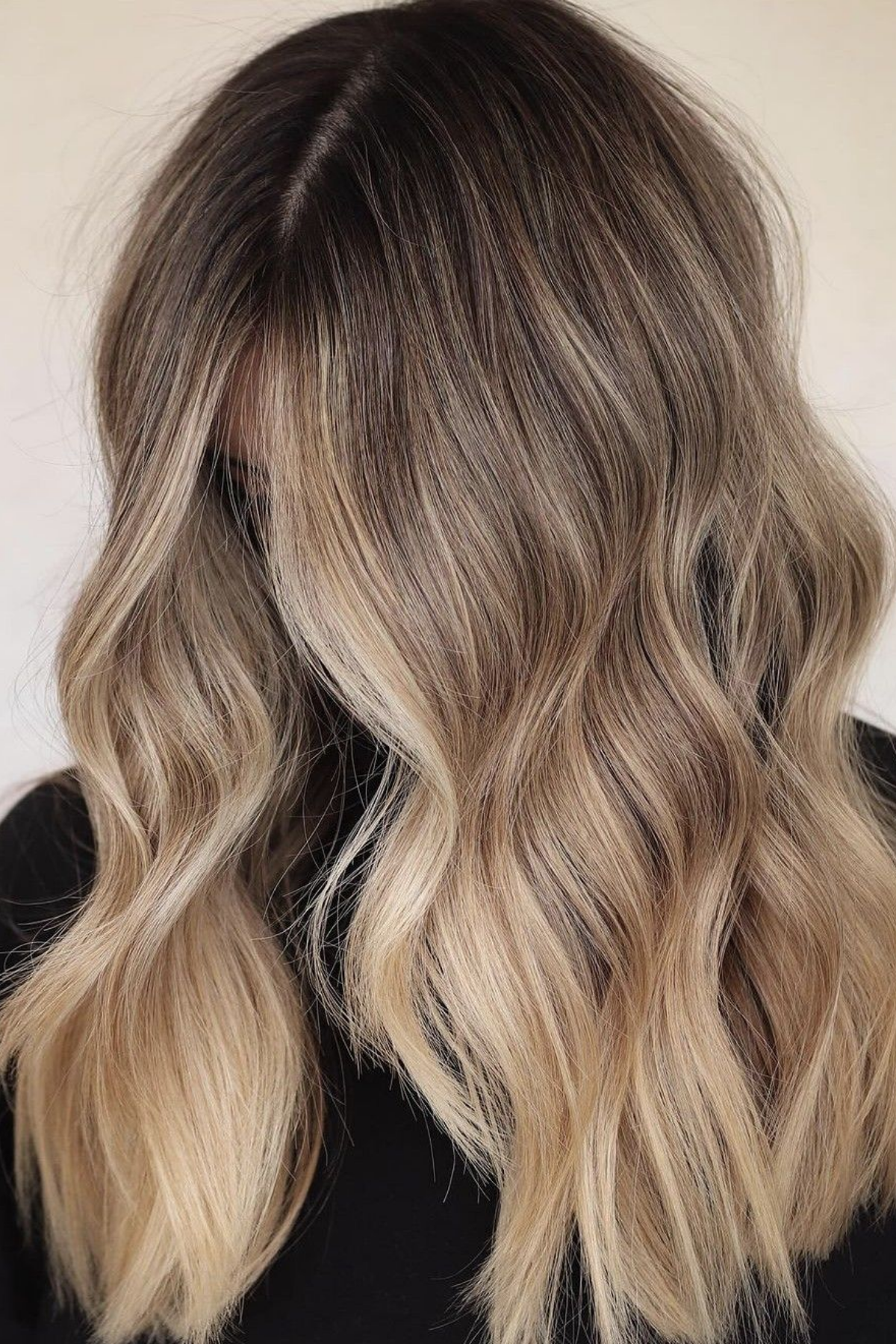 rooted blonde with an intentional root shadow, lived-in low-maintenance finish