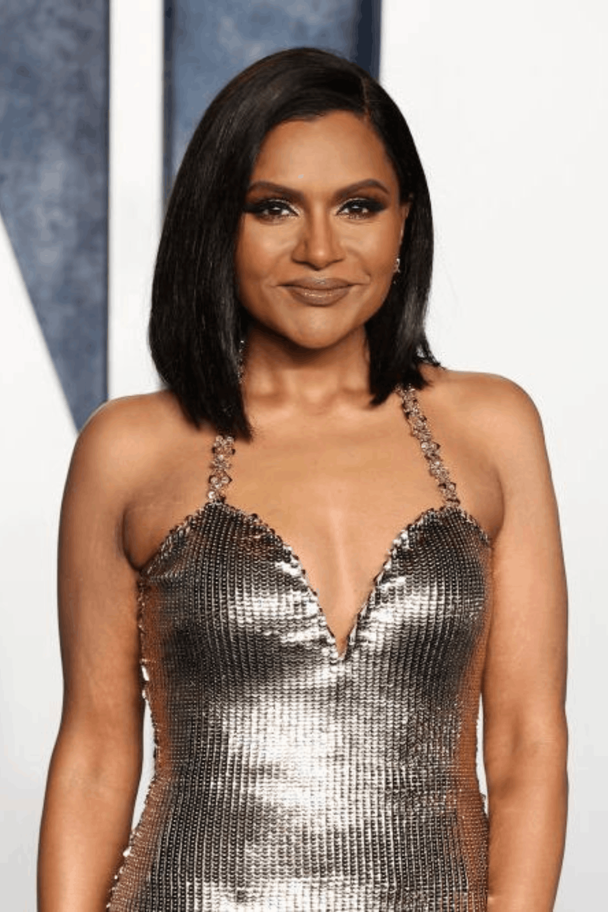 Woman with a side-parted bob, styled with added volume and smooth layers for a full, rounded shape.