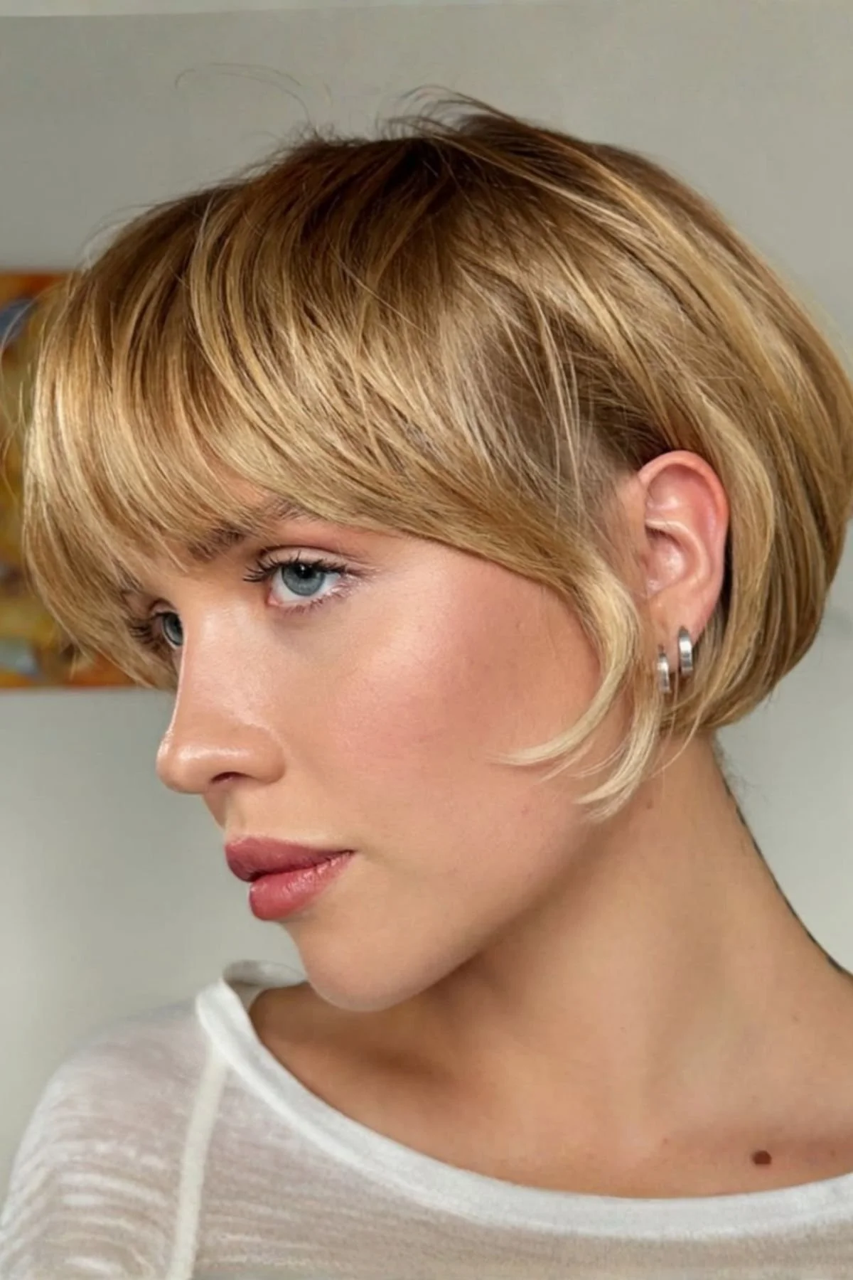 Girl with a Volume-Boosting Bixie for Fine Hair haircut, designed with layered texture to create fullness and lift.