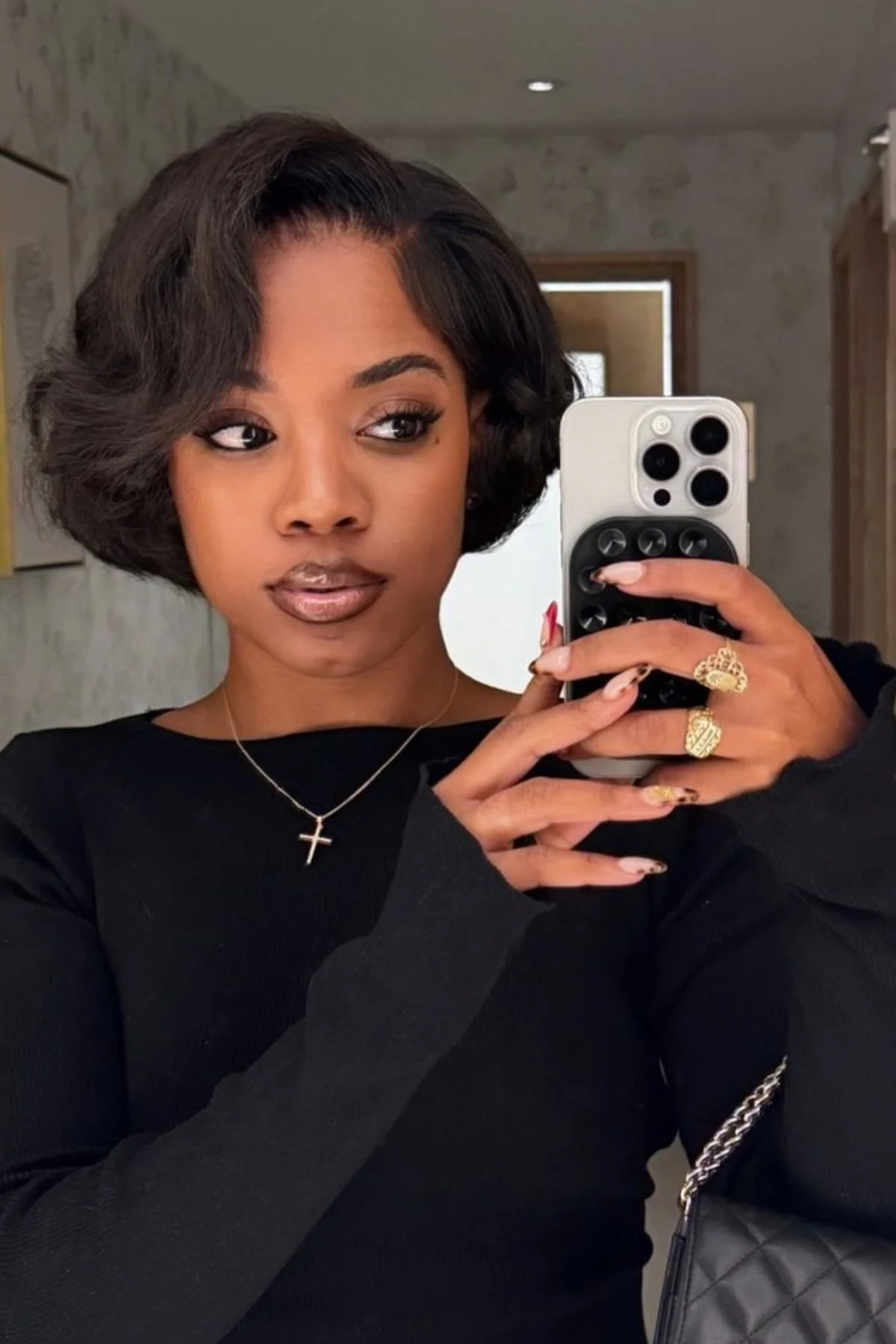Black woman wearing a Bixie Haircut for Black Women, showcasing a stylish pixie-bob blend tailored to natural texture.