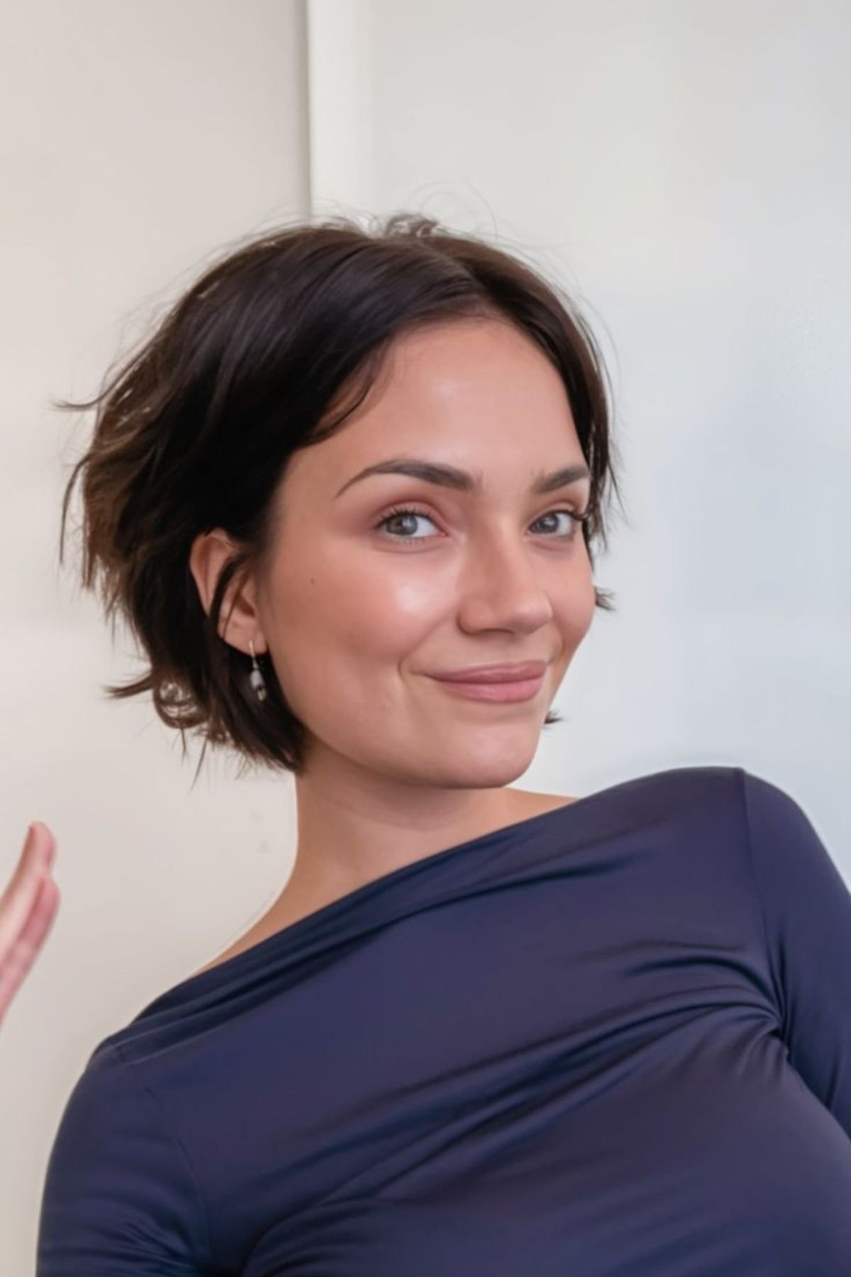 Girl styled in a Tousled French-Inspired Bixie haircut, combining effortless texture with a chic Parisian vibe.