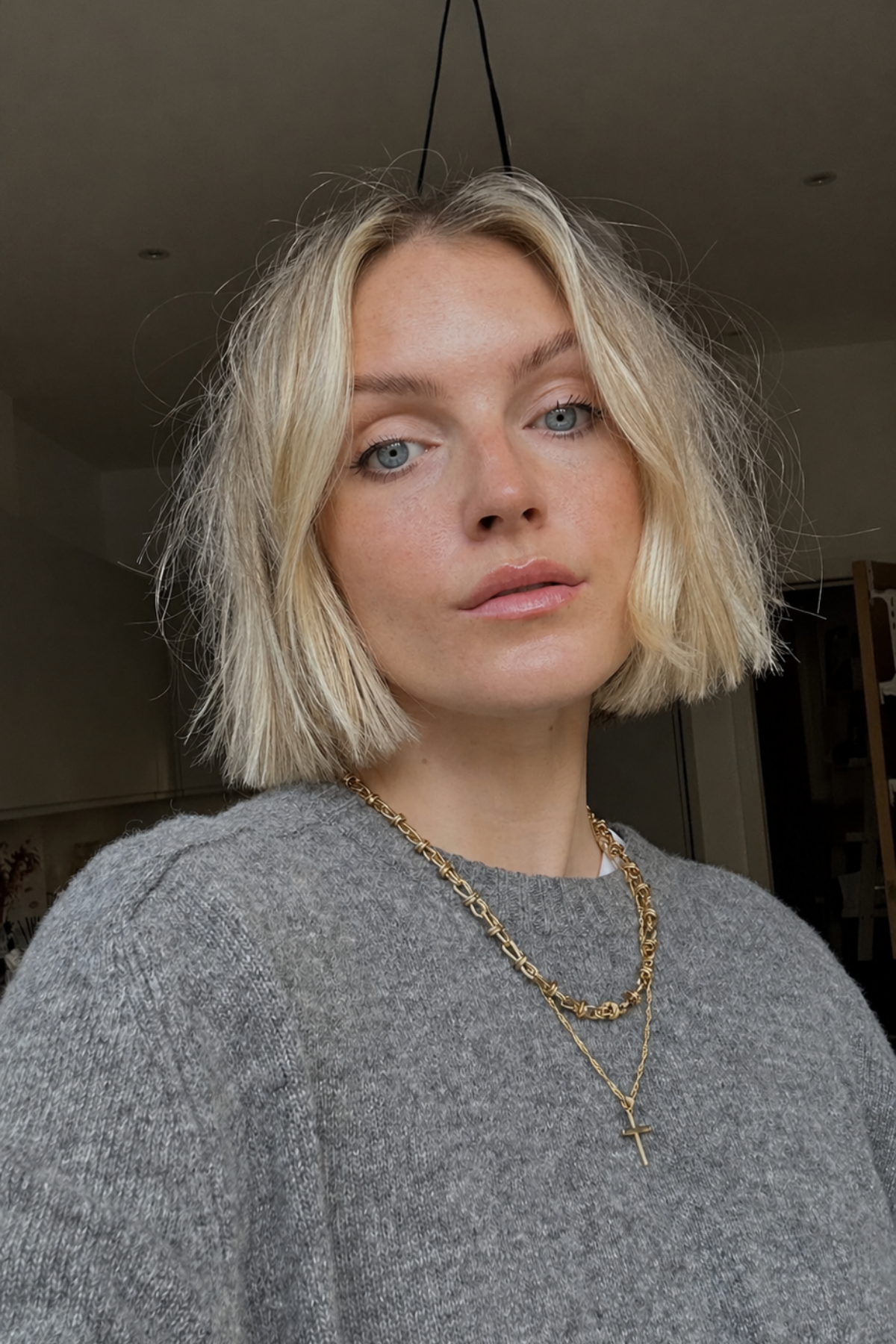 Girl with a Textured Bob haircut featuring soft broken ends and airy layers, perfect for a lightweight summer look on thick hair.