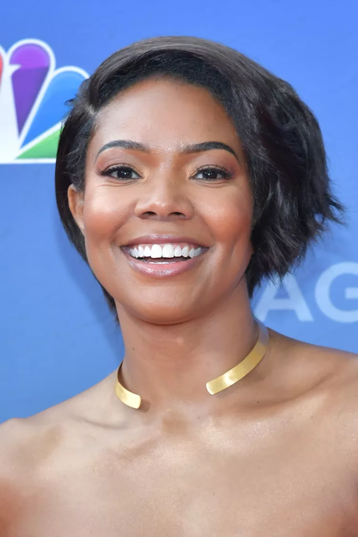 Front-facing image of a person wearing Blended Pixie Bob with Flipped Ends, featuring a short pixie-bob hybrid with softly blended layers and subtle flipped-out ends along one side for added movement.