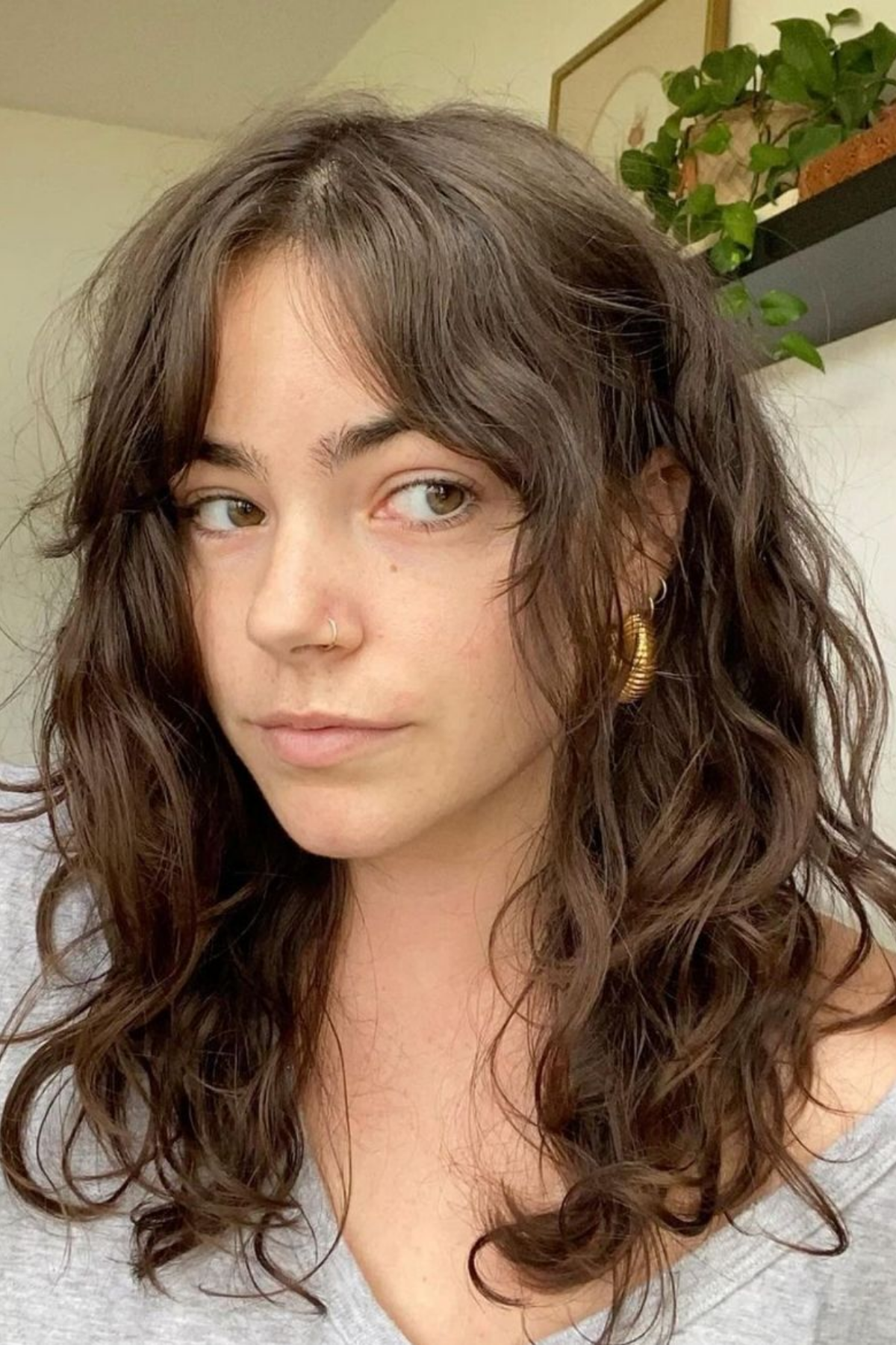 internally layered mid-length cut on thick wavy hair lying flat