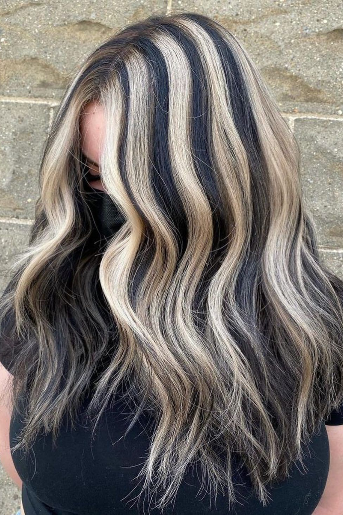 chunky high-contrast blonde highlights on black hair