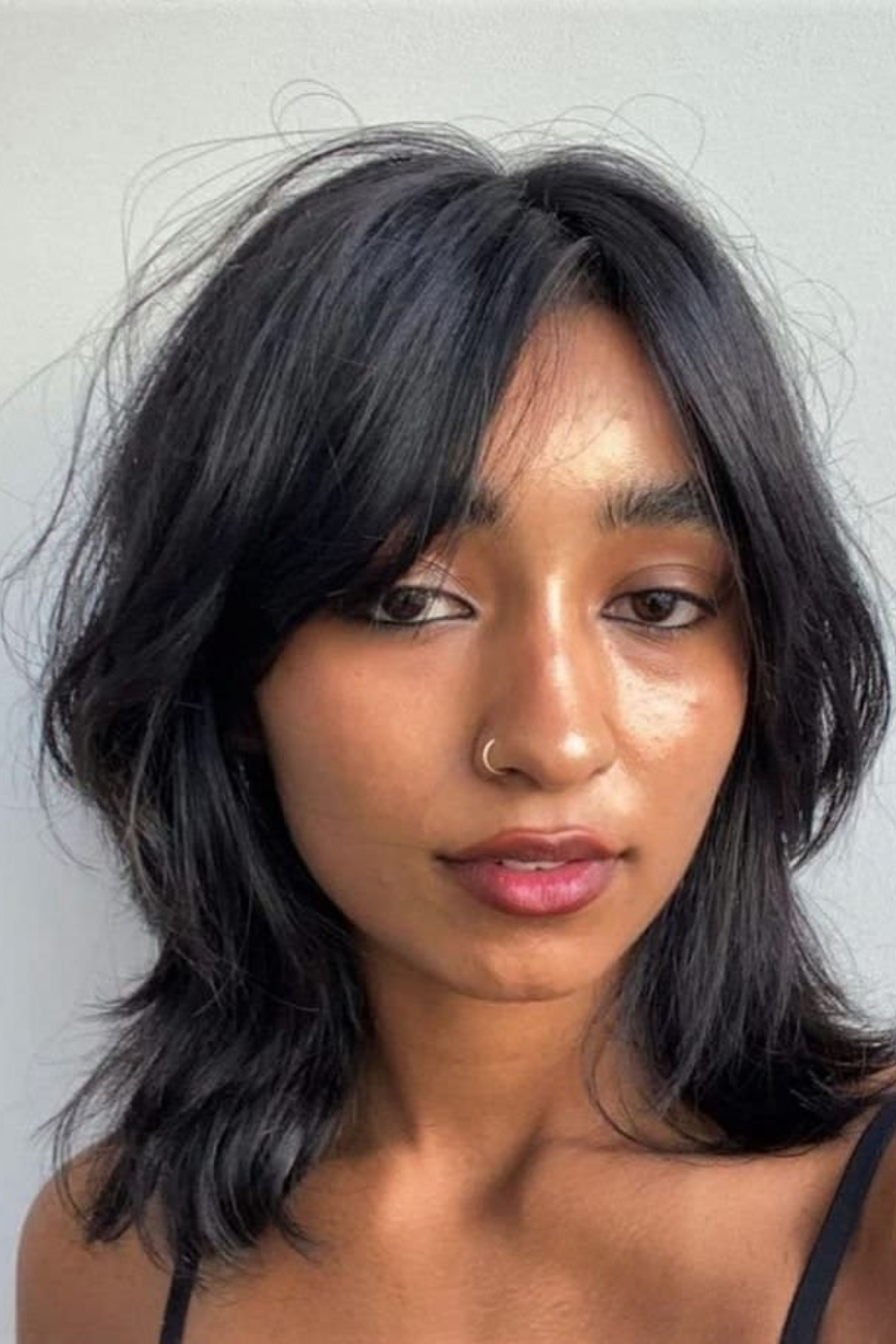 Girl wearing choppy bangs