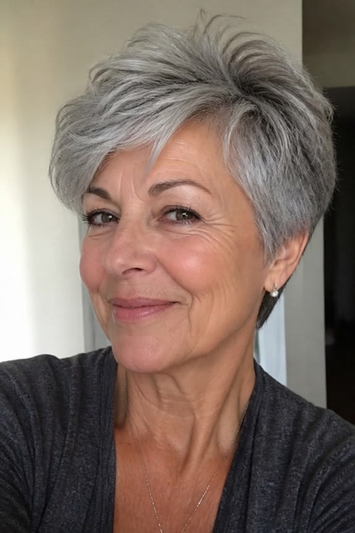 Textured pixie on fine silver-grey hair with volume concentrated on top