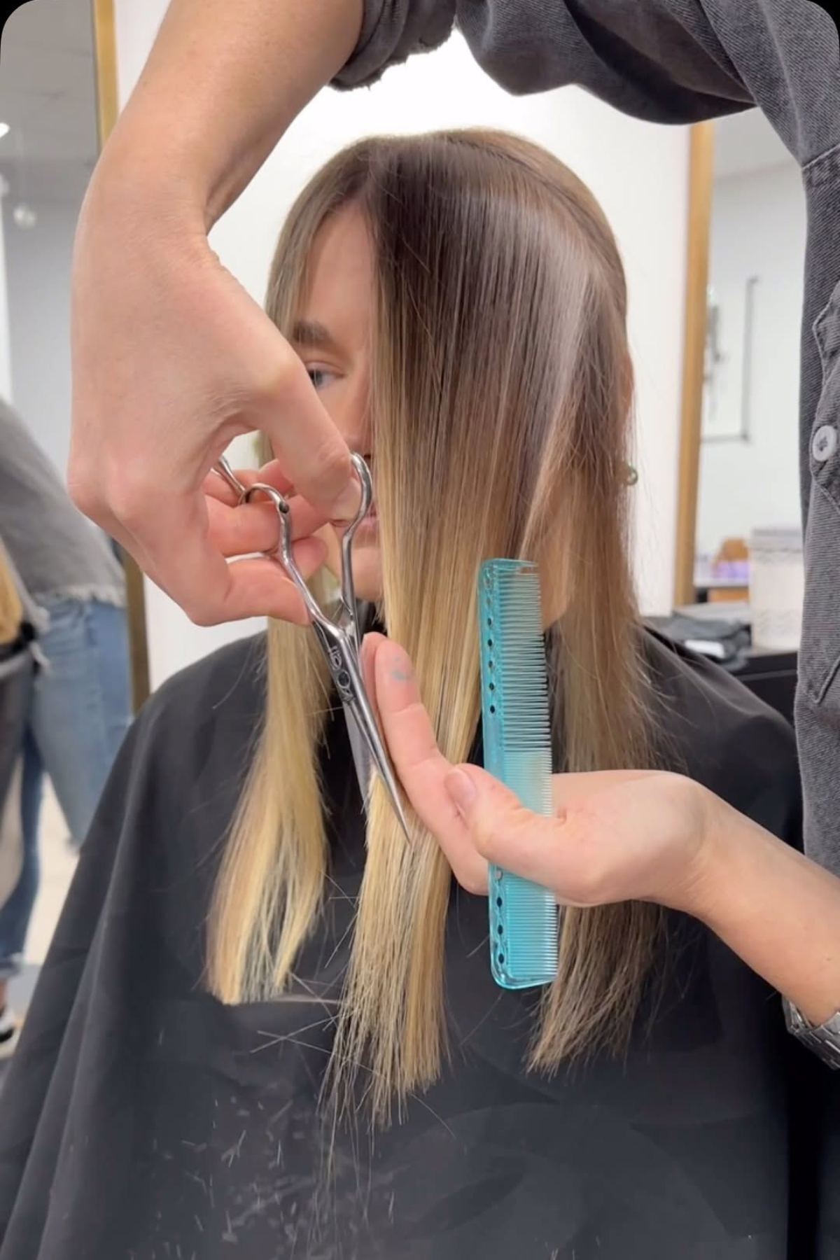 Hairstylist fixing the hair