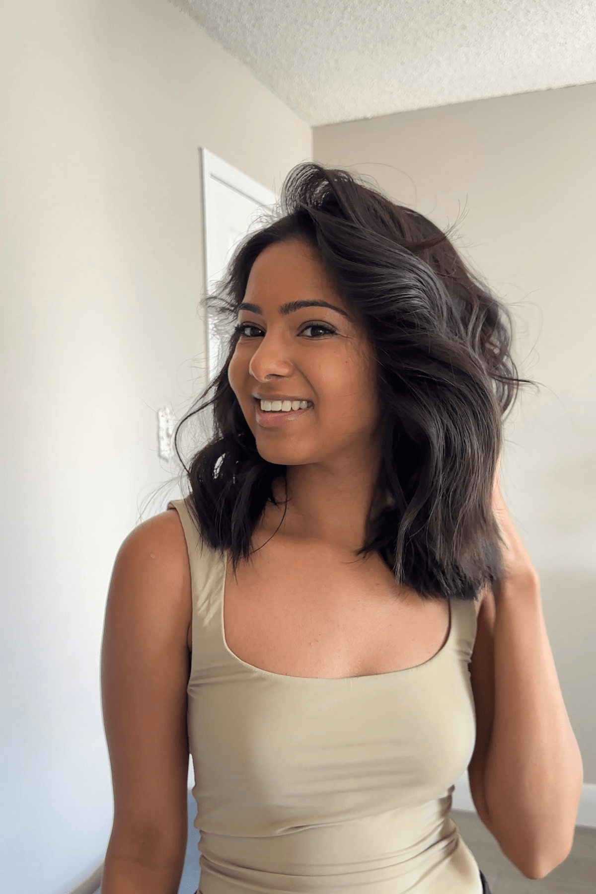 using a wand to curl short hair