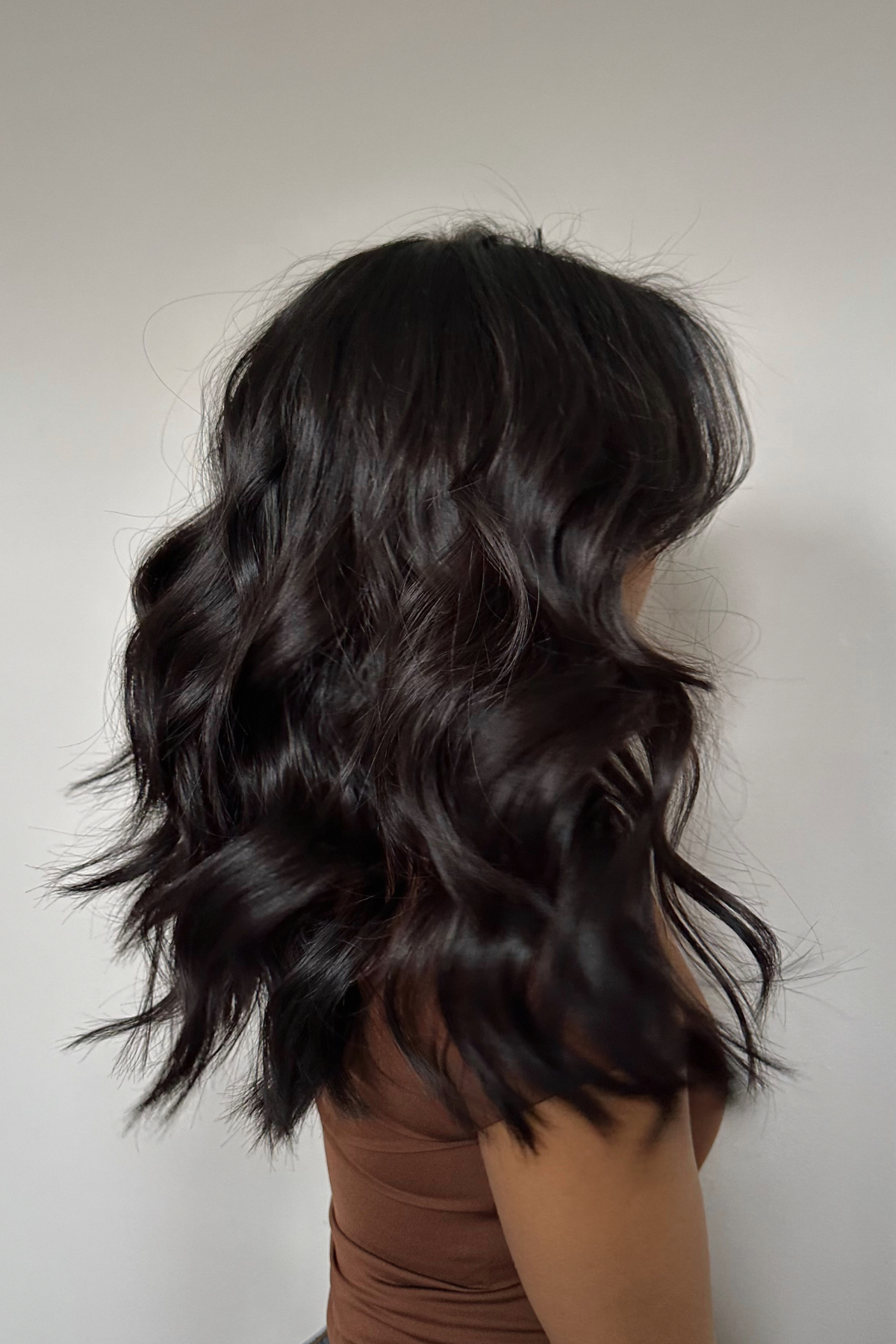 A woman with curls on short hair