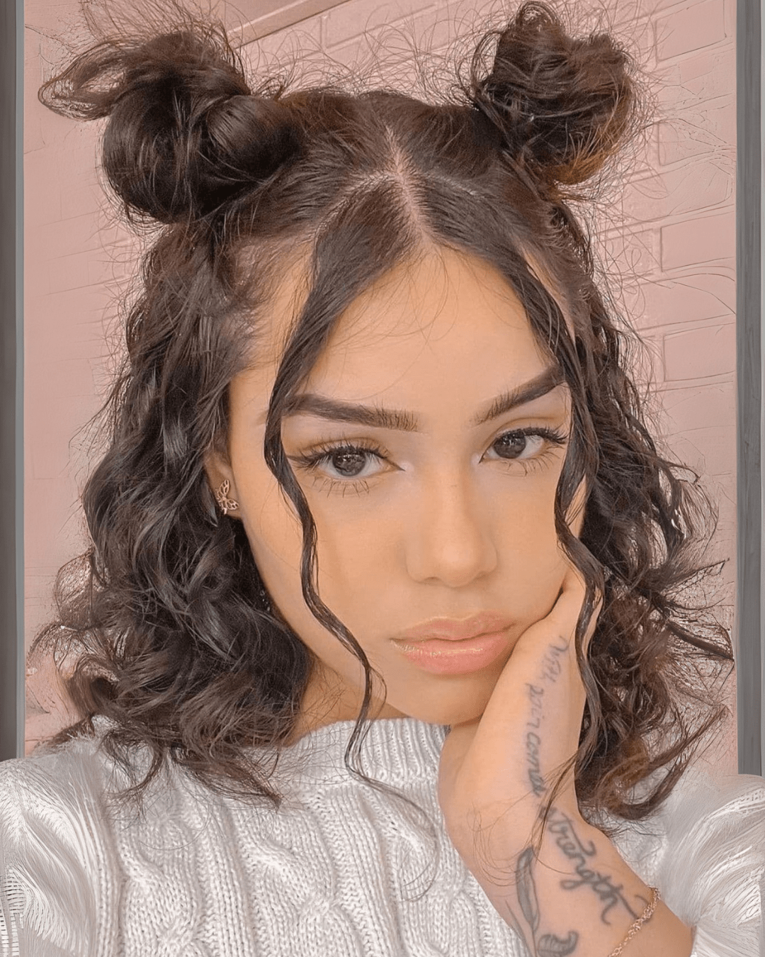 Mini Topknots with Holiday Accessories featuring curly hair in playful mini buns with loose tendrils.