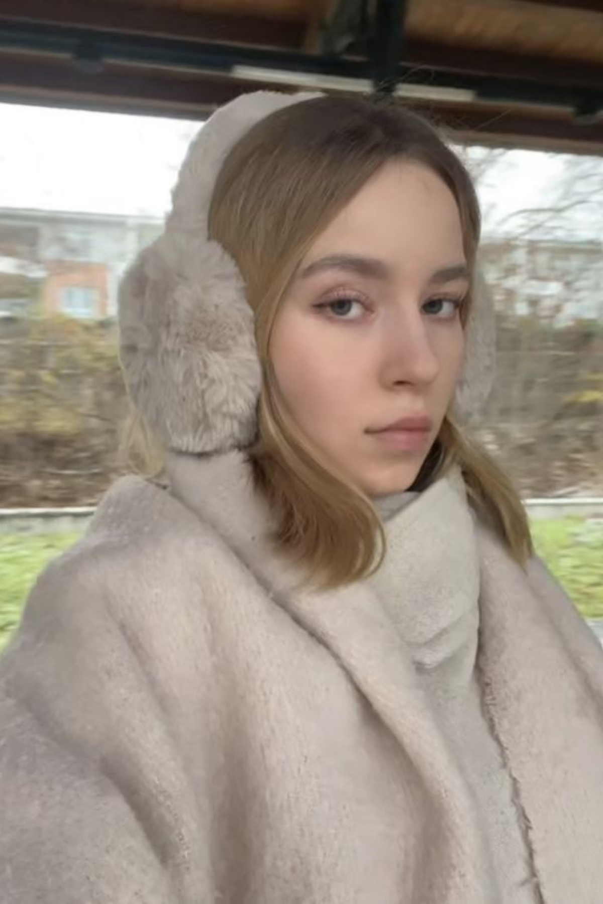 Earmuffs keeping ears warm without flattening the crown of a short haircut