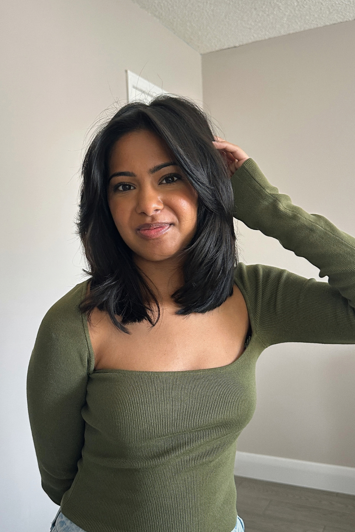 A collarbone-length cut with long layers on thick hair