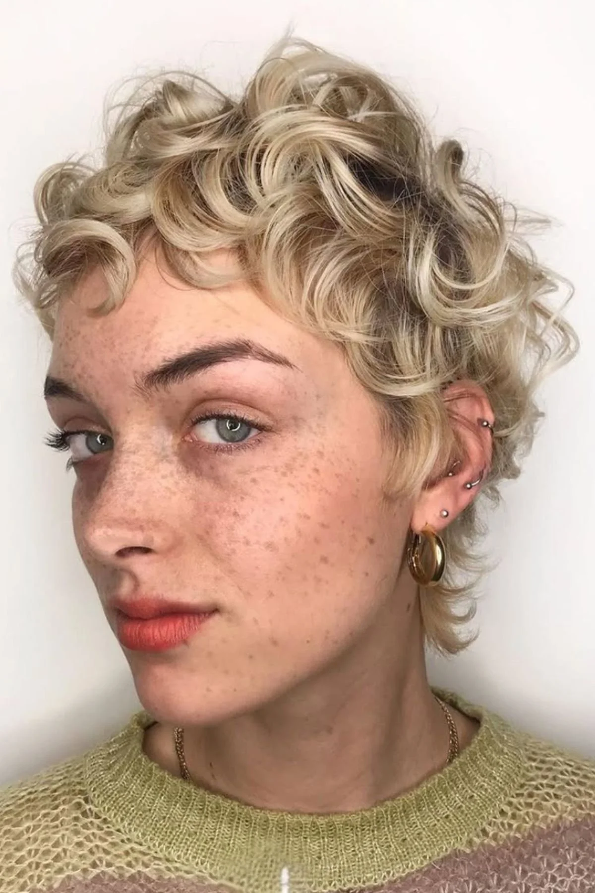 Woman wearing Curly Crop with Light Undercut.