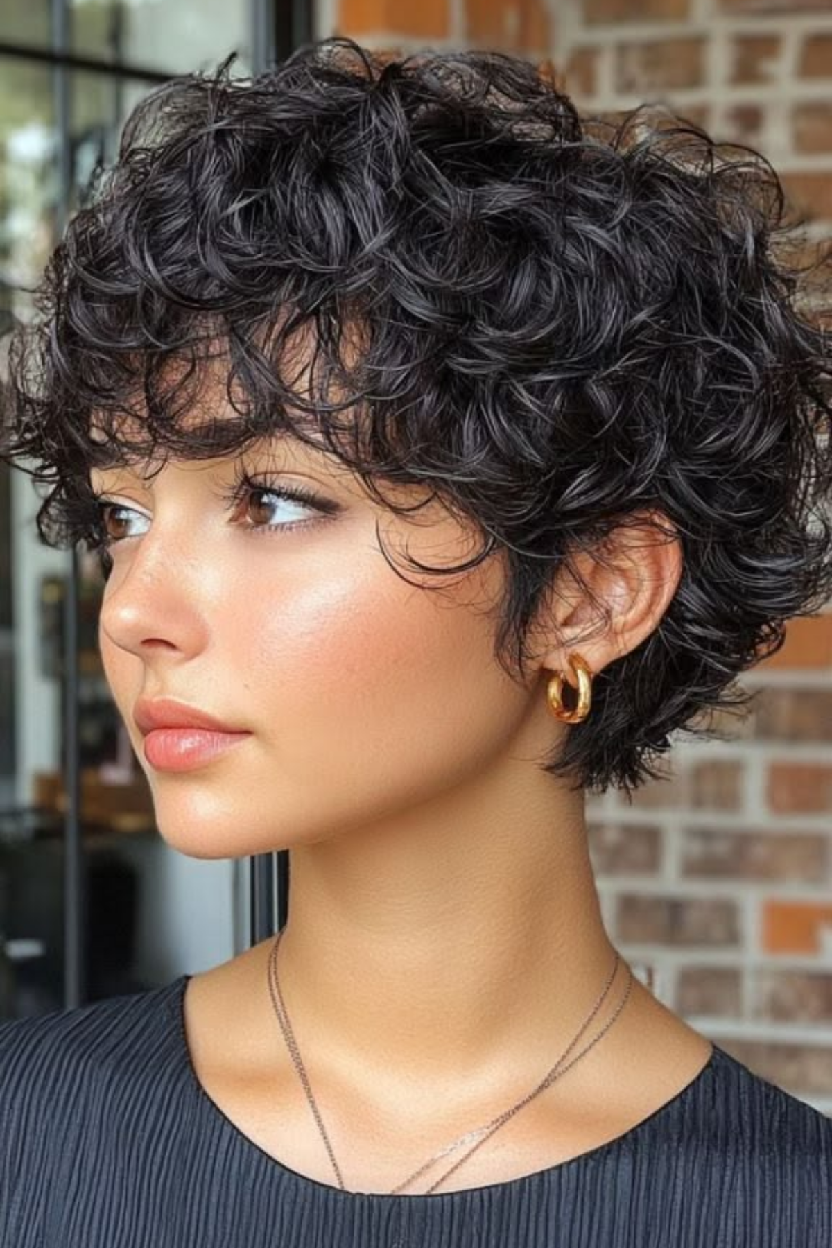 Short curly crop with shaped corners and no triangle shelf at the bottom