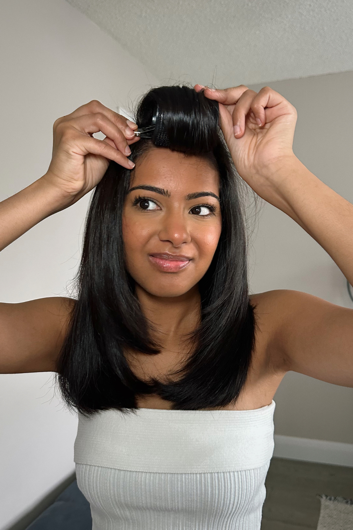 Jennifer doing velcro roller technique on her hair