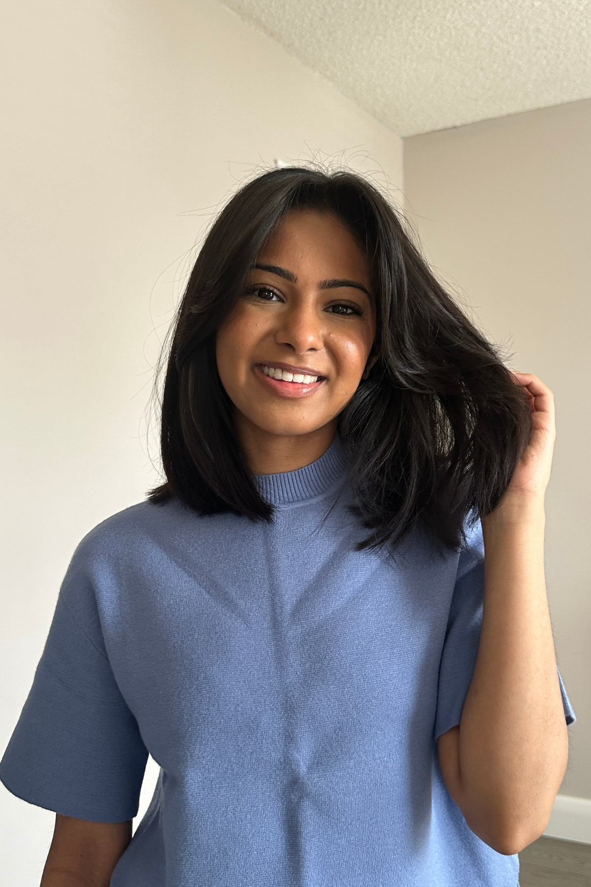 A layered long bob sitting at the collarbone with movement through the ends