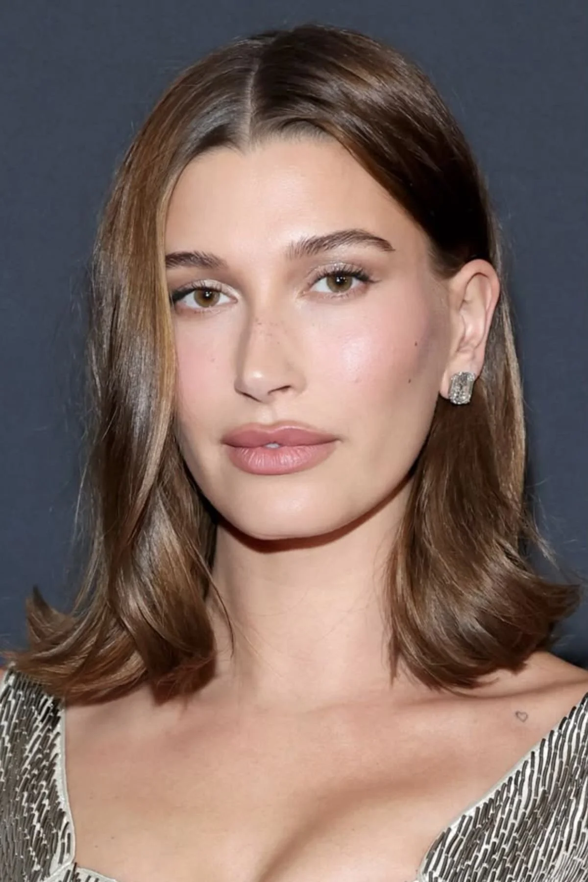 Girl with a Collarbone-Length Straight Cut haircut showcasing smooth straight strands and a clean modern finish.