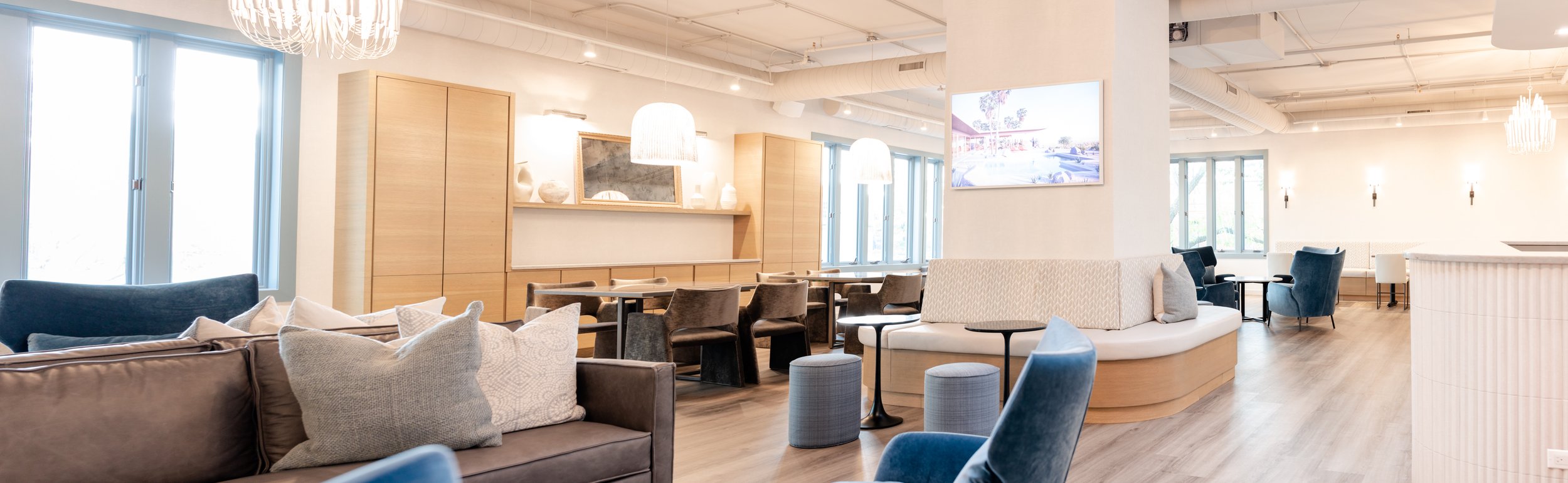 wide shot of event space featuring multiple seating areas 