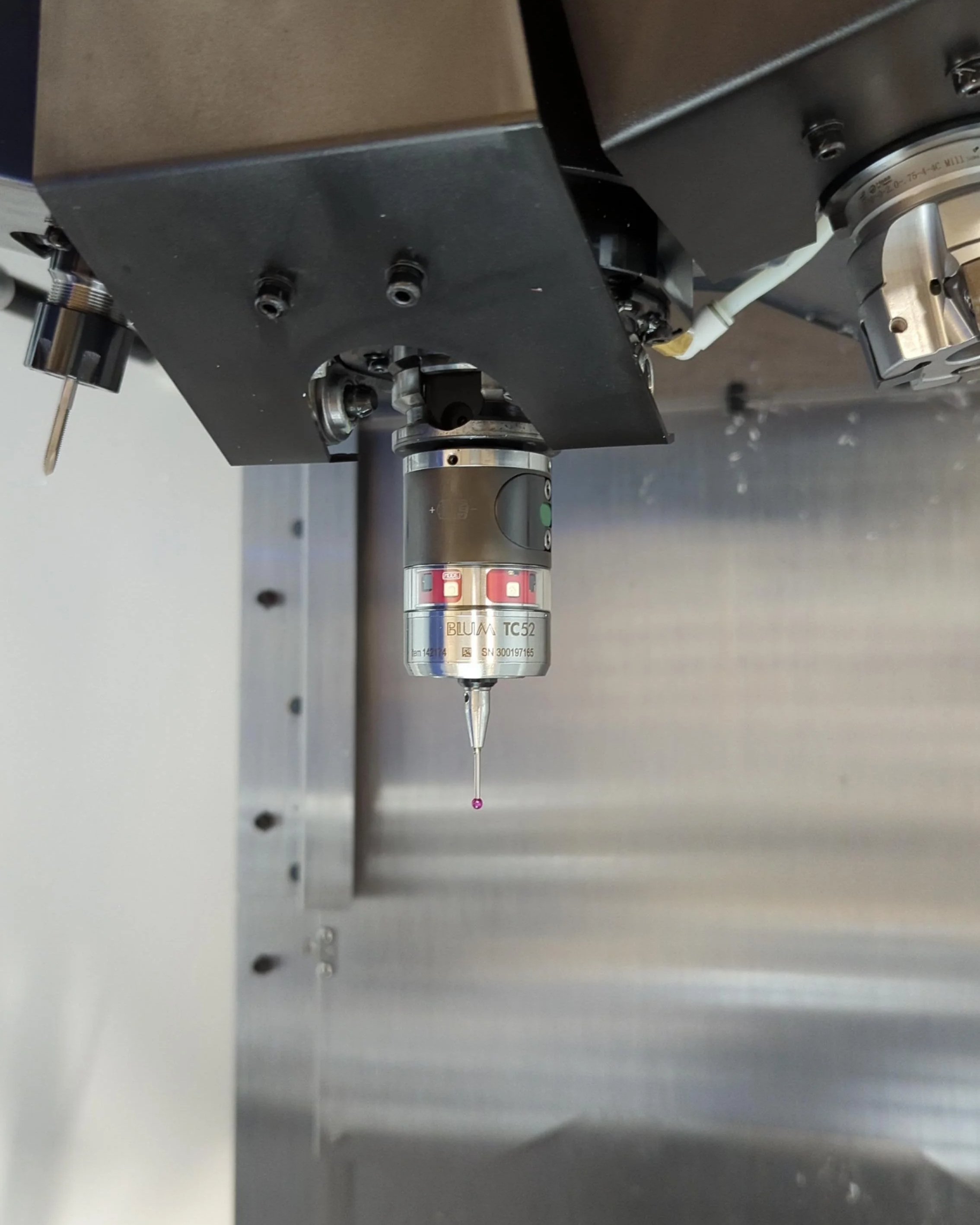 Blum TC-52 spindle probe for picking up zero points, also capable of in process measurement of machined parts.