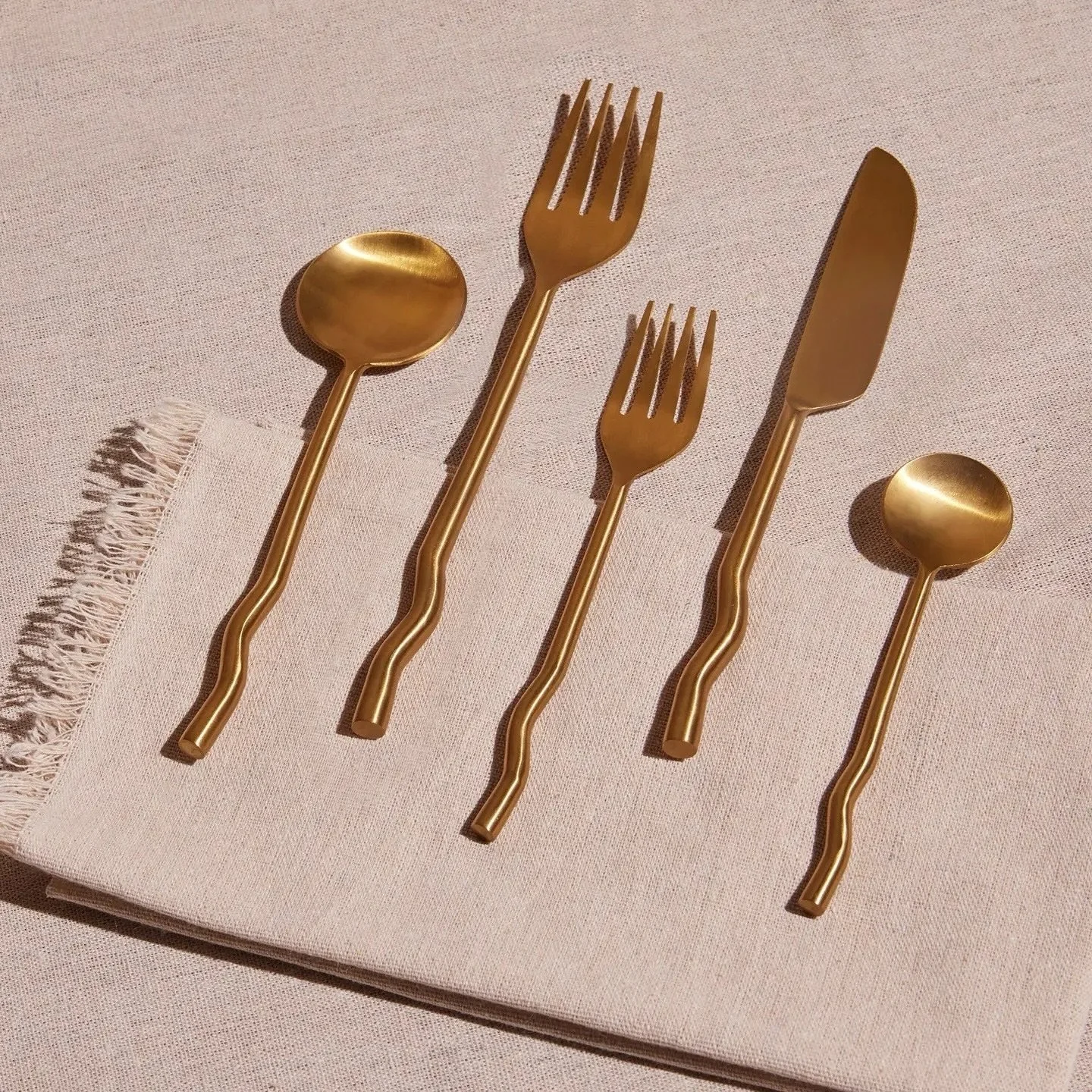 Not me snatching up anything squiggly I can get my hands on. Squiggle flatware in brushed gold coming for 2025 🆕