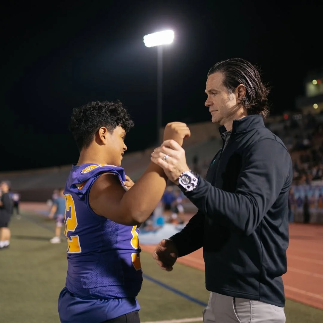 Sports medicine physician at Ortho San Antonio evaluating a muscle strain patient in San Antonio, Texas