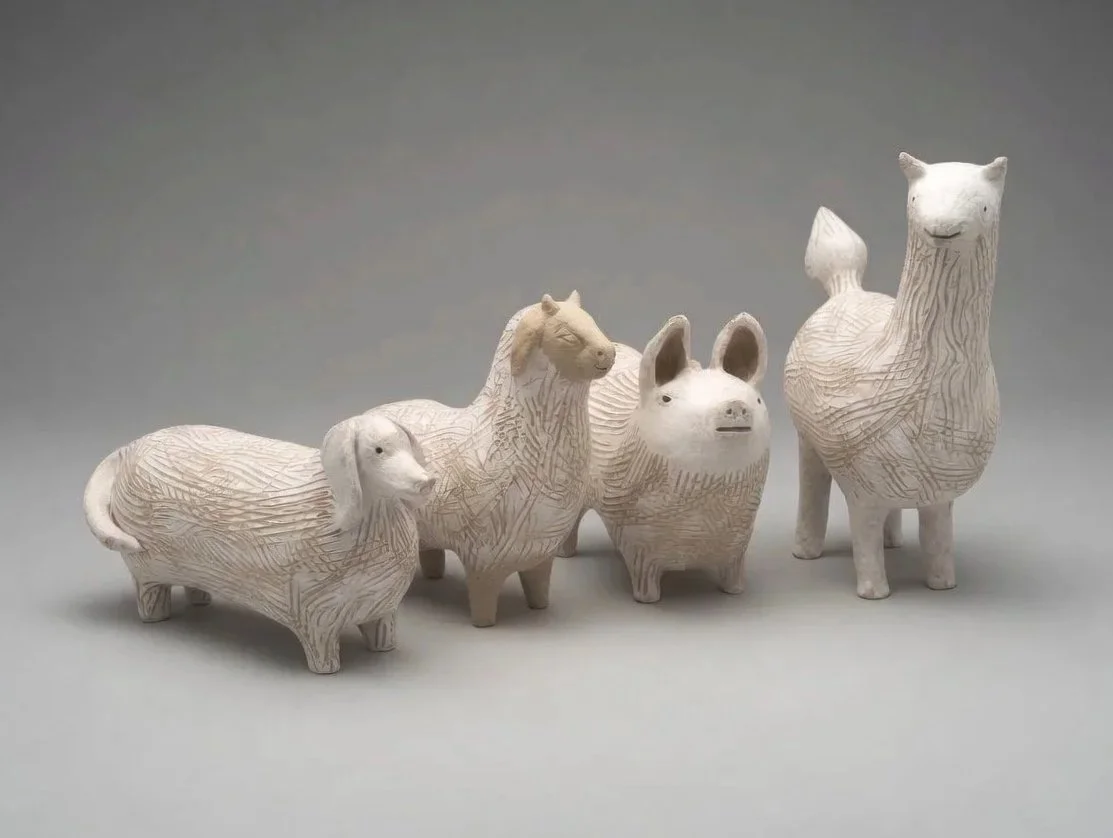 Common animals (dog, goat, pig, llama) with incised line patterns.