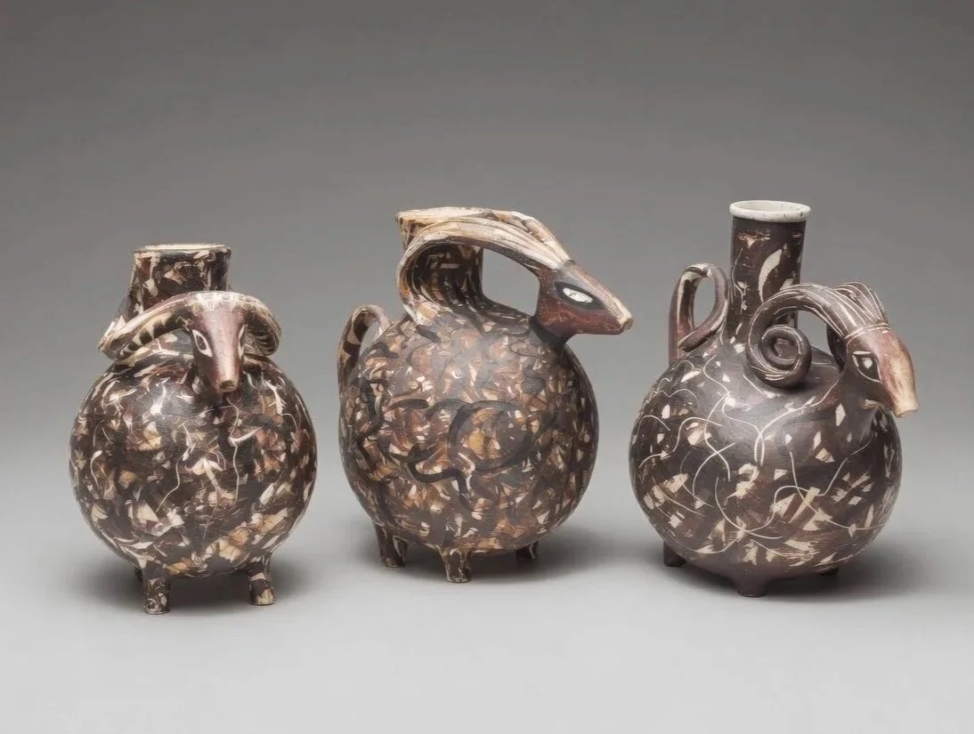 Etruscan-inspired rams in the bucchero-style (blackware).