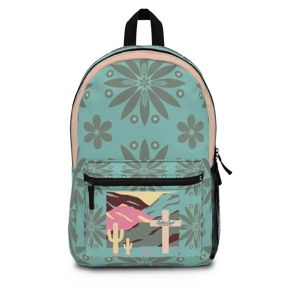 A backpack with a desert landscape and floral pattern, featuring a cross and cacti in the front pocket.