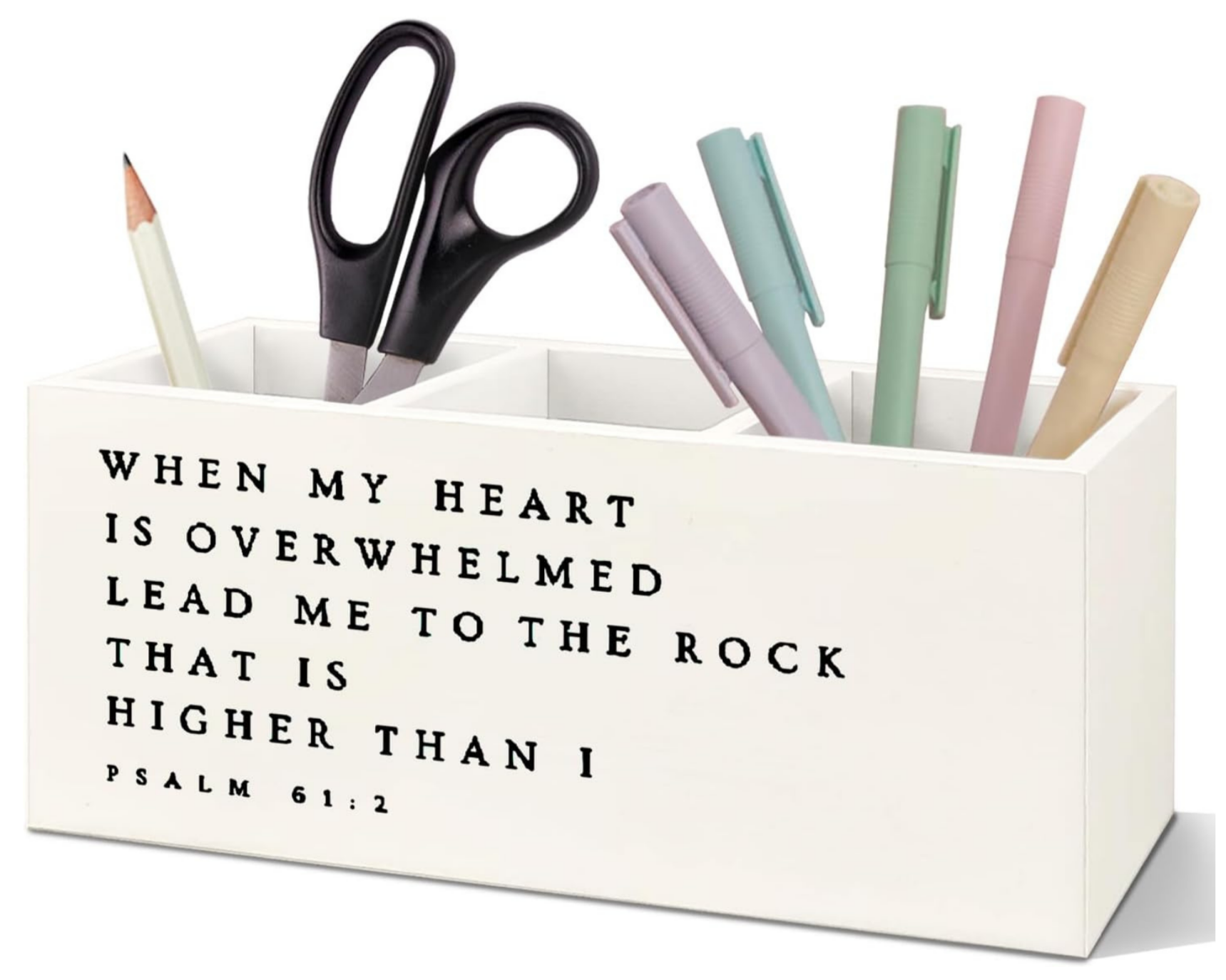 A white desk organizer with black text of a Bible verse from Psalm 61:2. The organizer holds pencils, scissors, and pastel-colored pens.