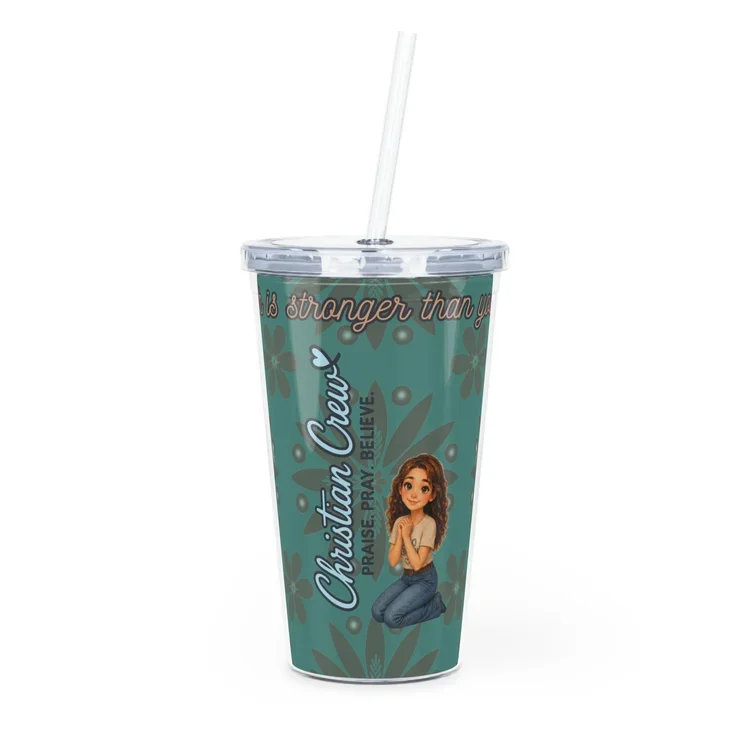 A plastic tumbler with a straw featuring Christian prayer phrases, the name Christian Cuey, and a cartoon girl kneeling with prayer hands on a teal background with floral designs.