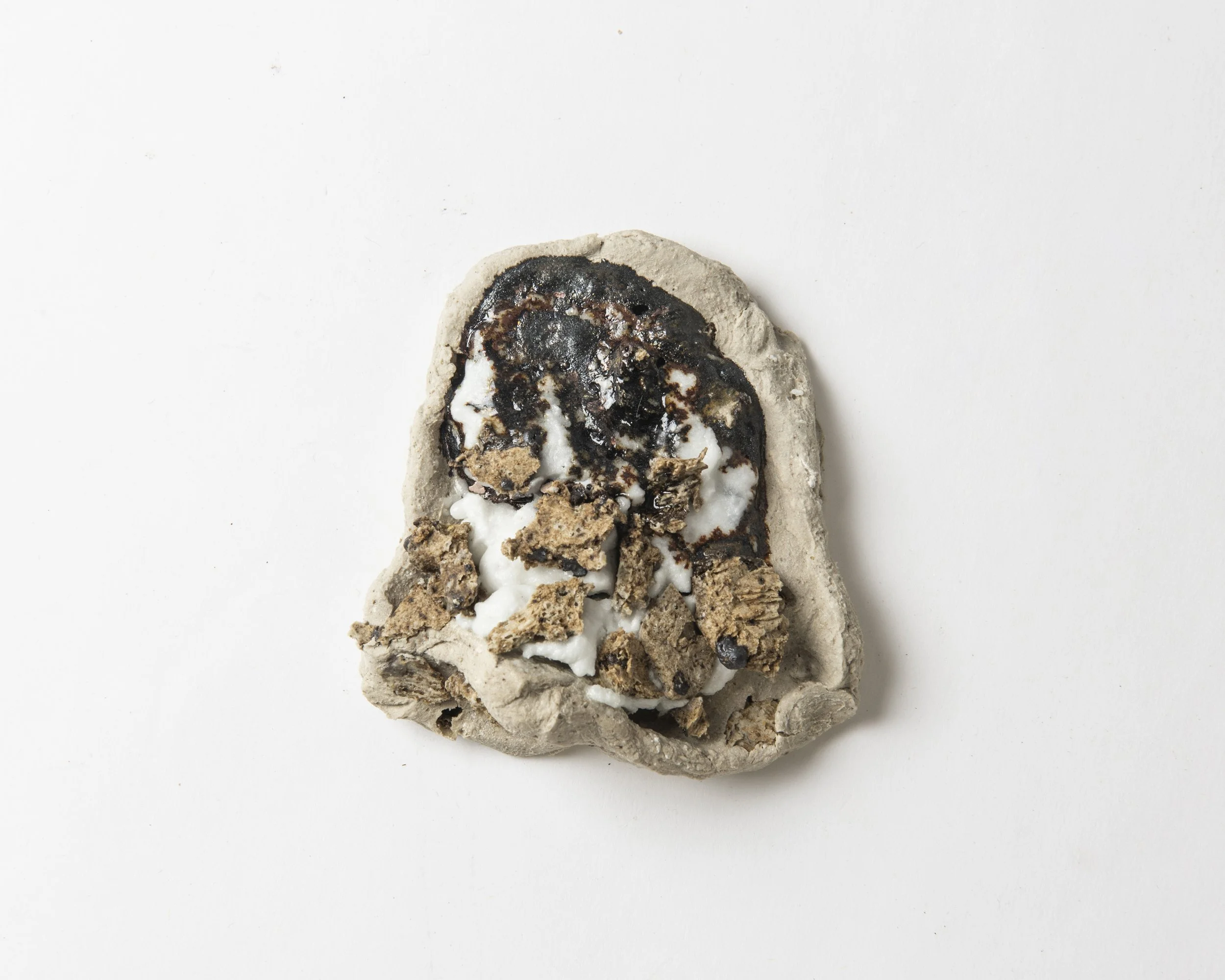 Portal remnants IV, 2025, stoneware ceramics: ball clay, silica, ash, potash feldspar, eggshells, metal, 9 x 8 x 3.2cm. 